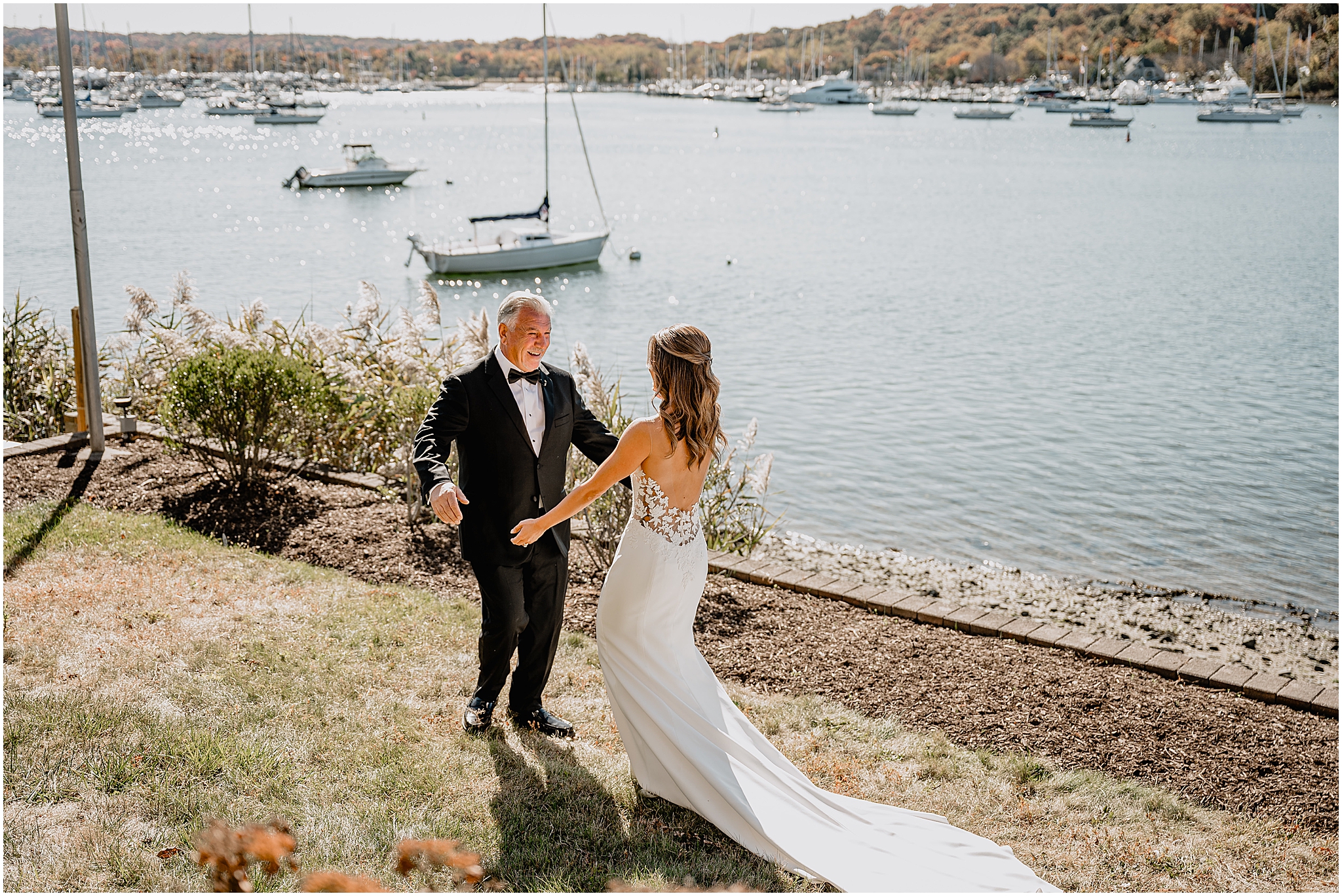 bride and dad face each other for hug during first look on Long Island