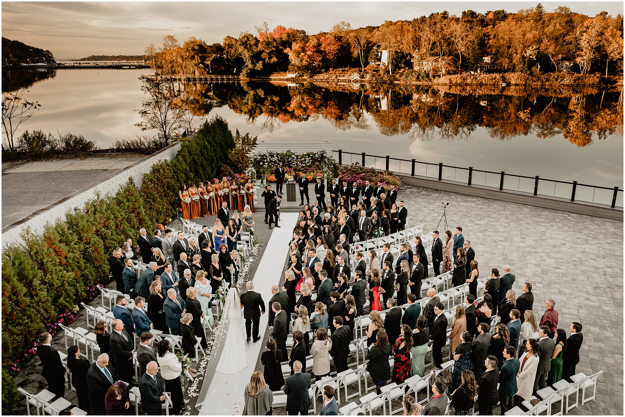 waterfront ceremony on the patio at the Waters Edge at Centerport in the fall