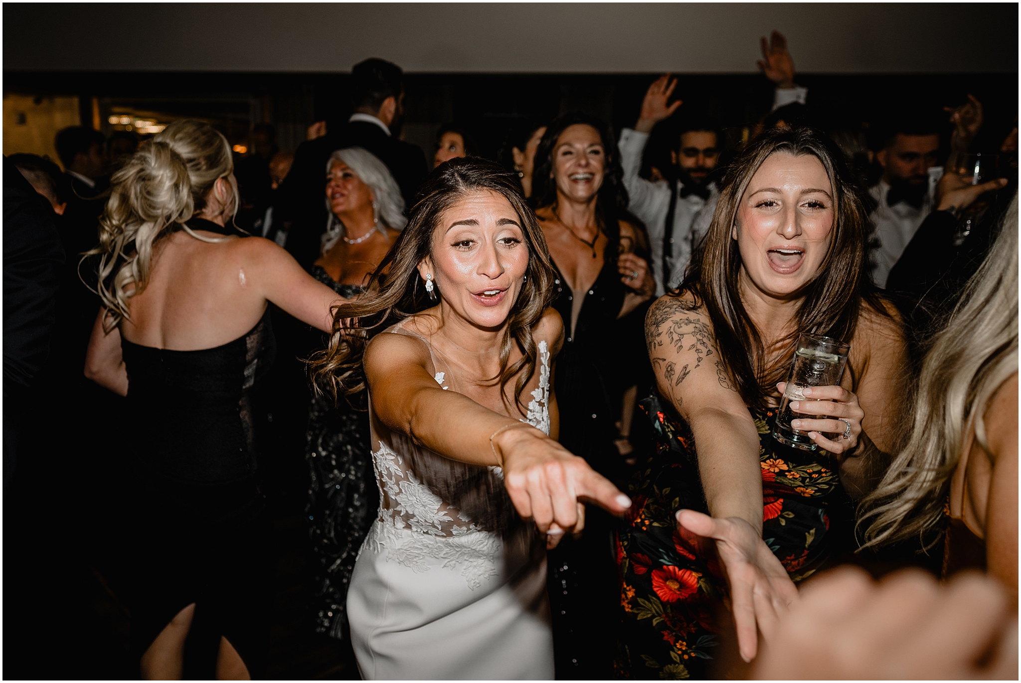 bride dances with guests during Long Island wedding reception