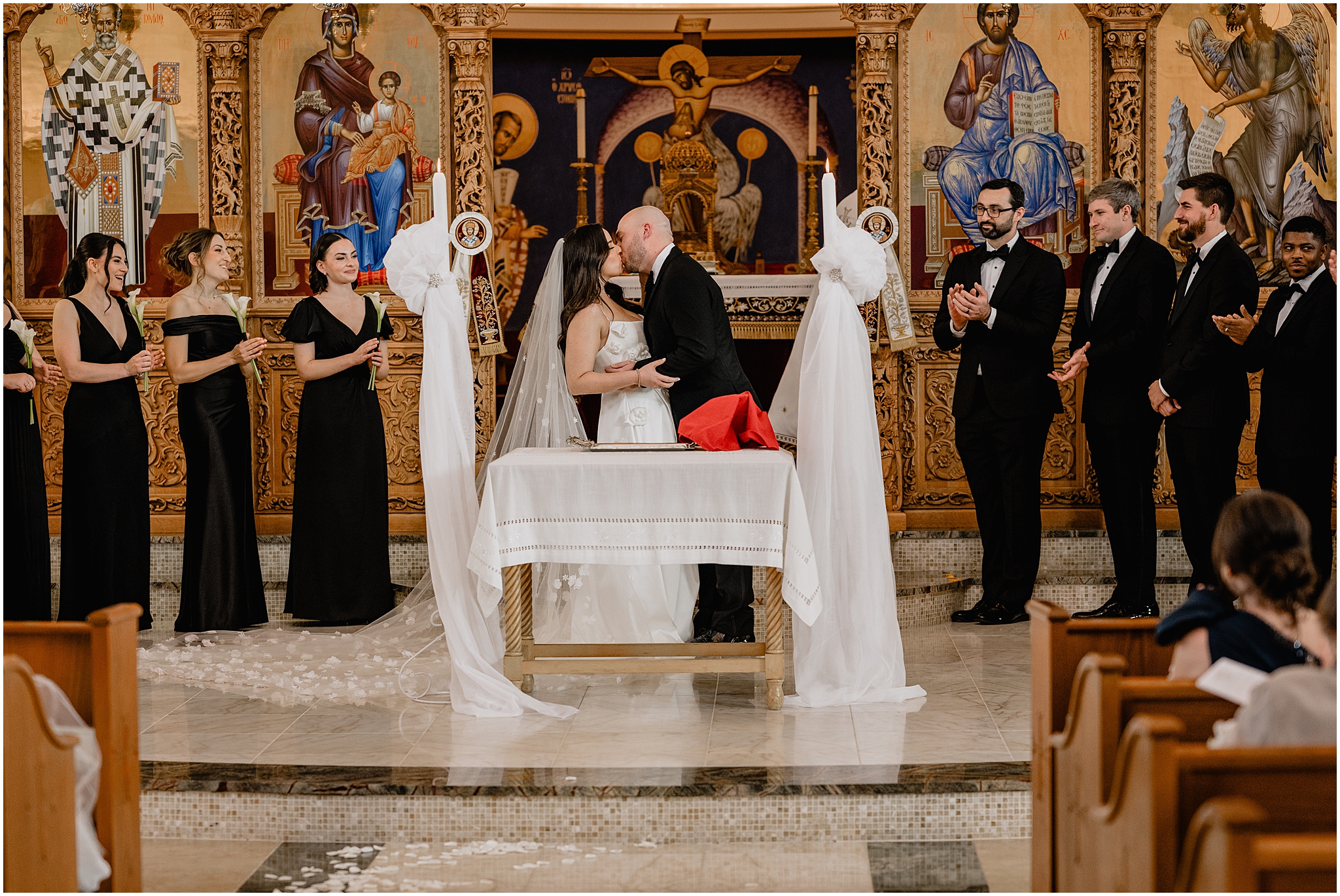 newlyweds kiss at alter during traditional church wedding in New Jersey