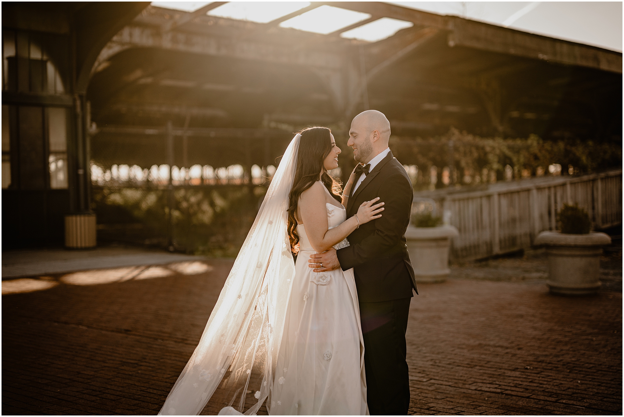 newlyweds hug outside Liberty House restaurant 