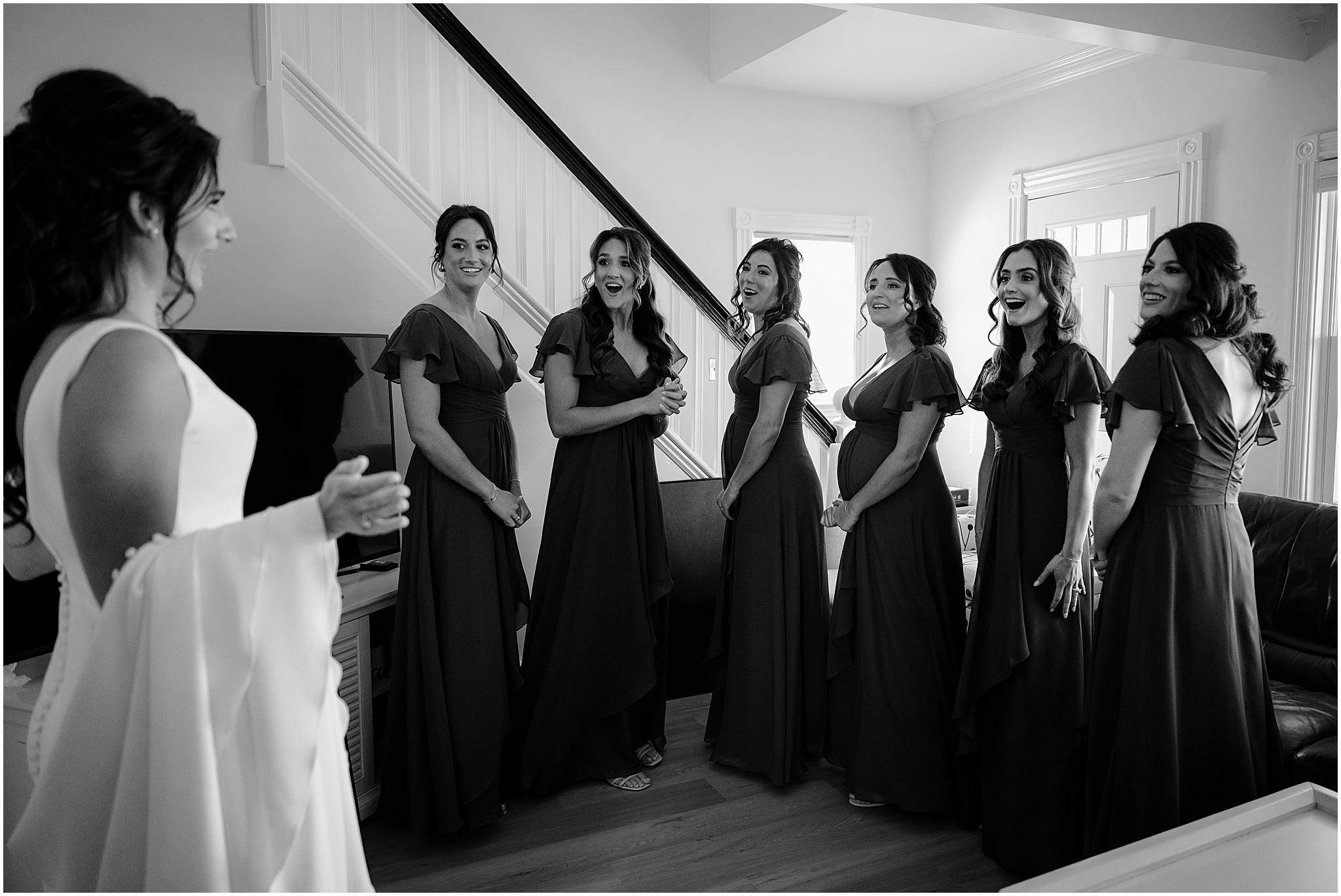 bridesmaids react to seeing bride in wedding gown during prep for NJ wedding