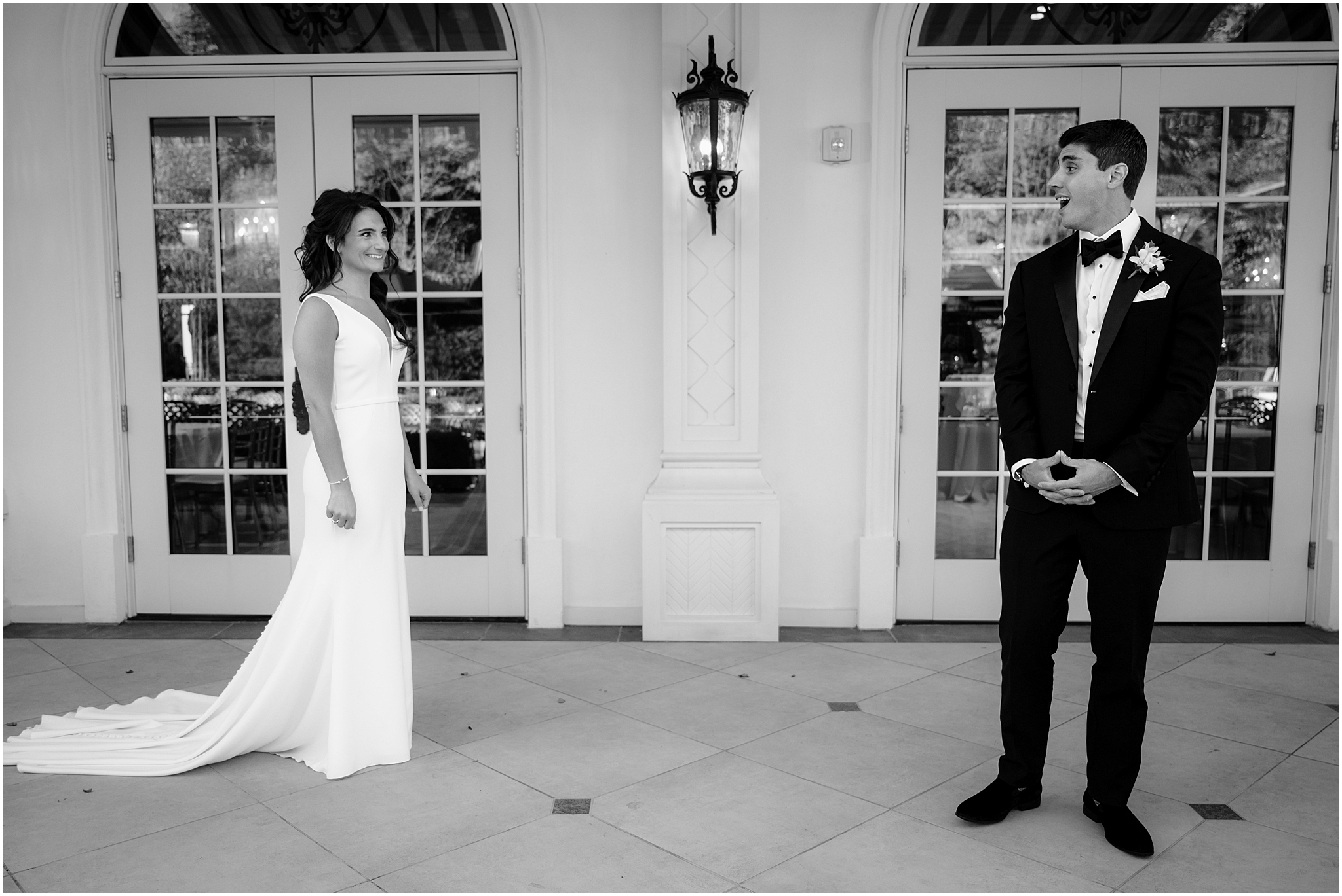 bride walks towards groom on the patio at The Shadowbrook at Shrewsbury