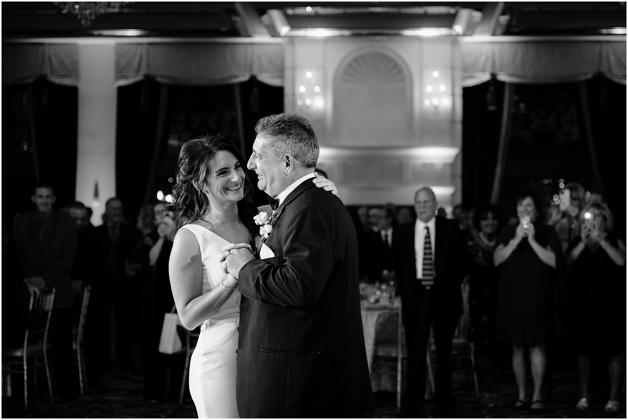 bride smiles dancing with father during New Jersey wedding reception 
