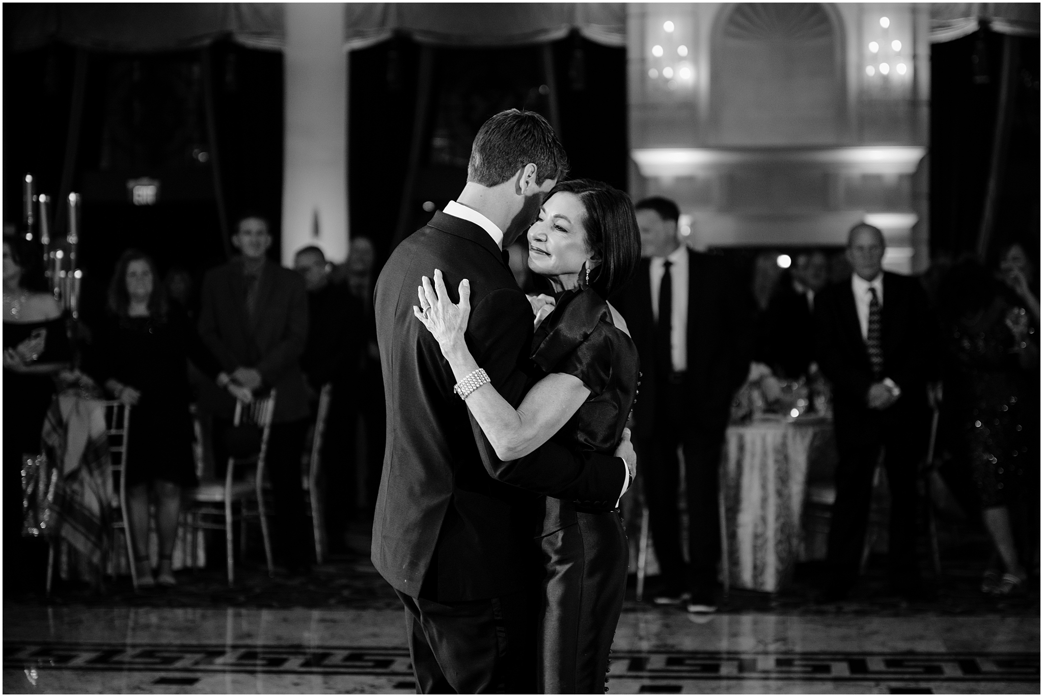 groom holds mother close dancing during New Jersey wedding reception 