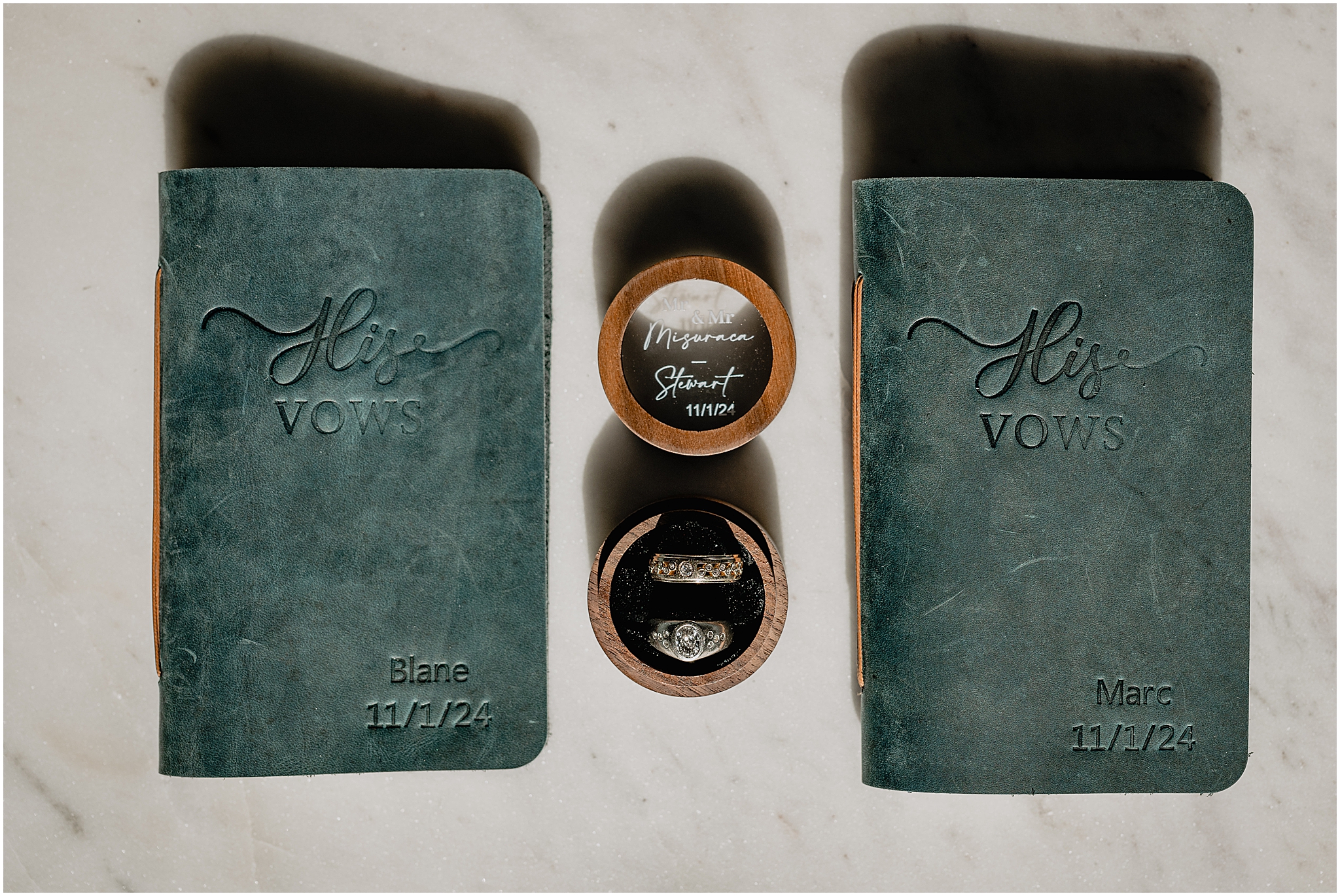 groom's green vow booklet with ring boxes