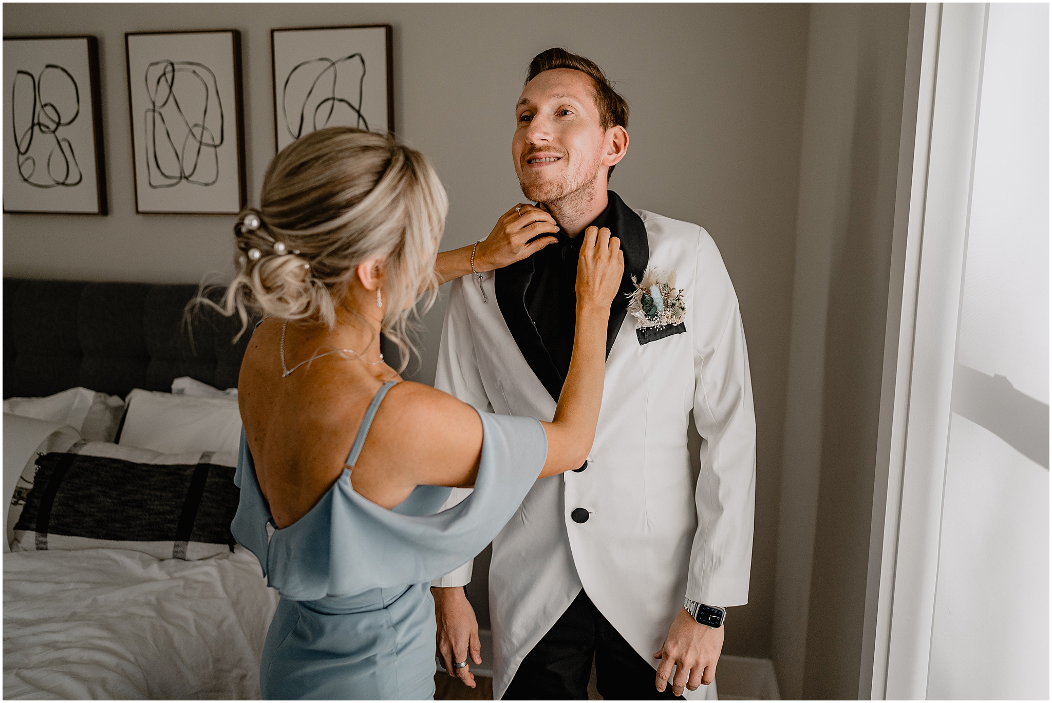 mother helps groom adjust tie during prep for Jersey City wedding