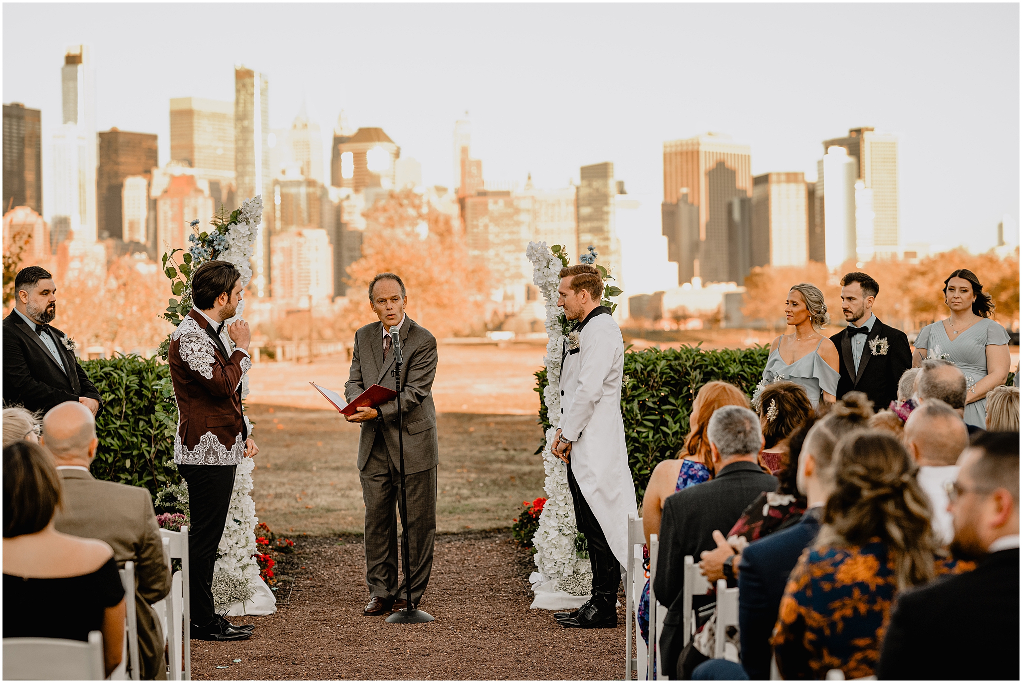 officiant reads during ceremony on the lawn at the Liberty House in Jersey City