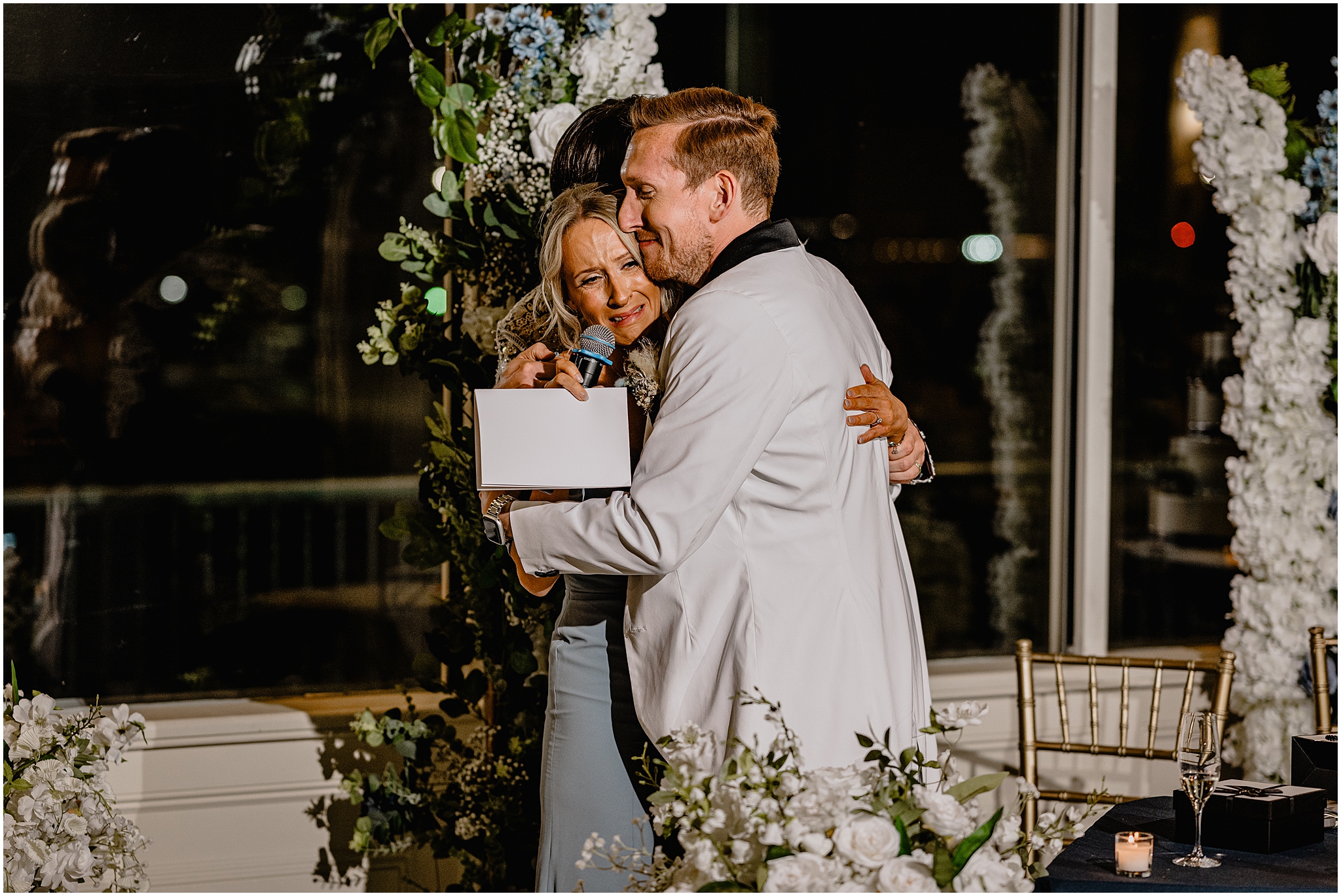grooms hug mother crying during toast at the Liberty House in Jersey City