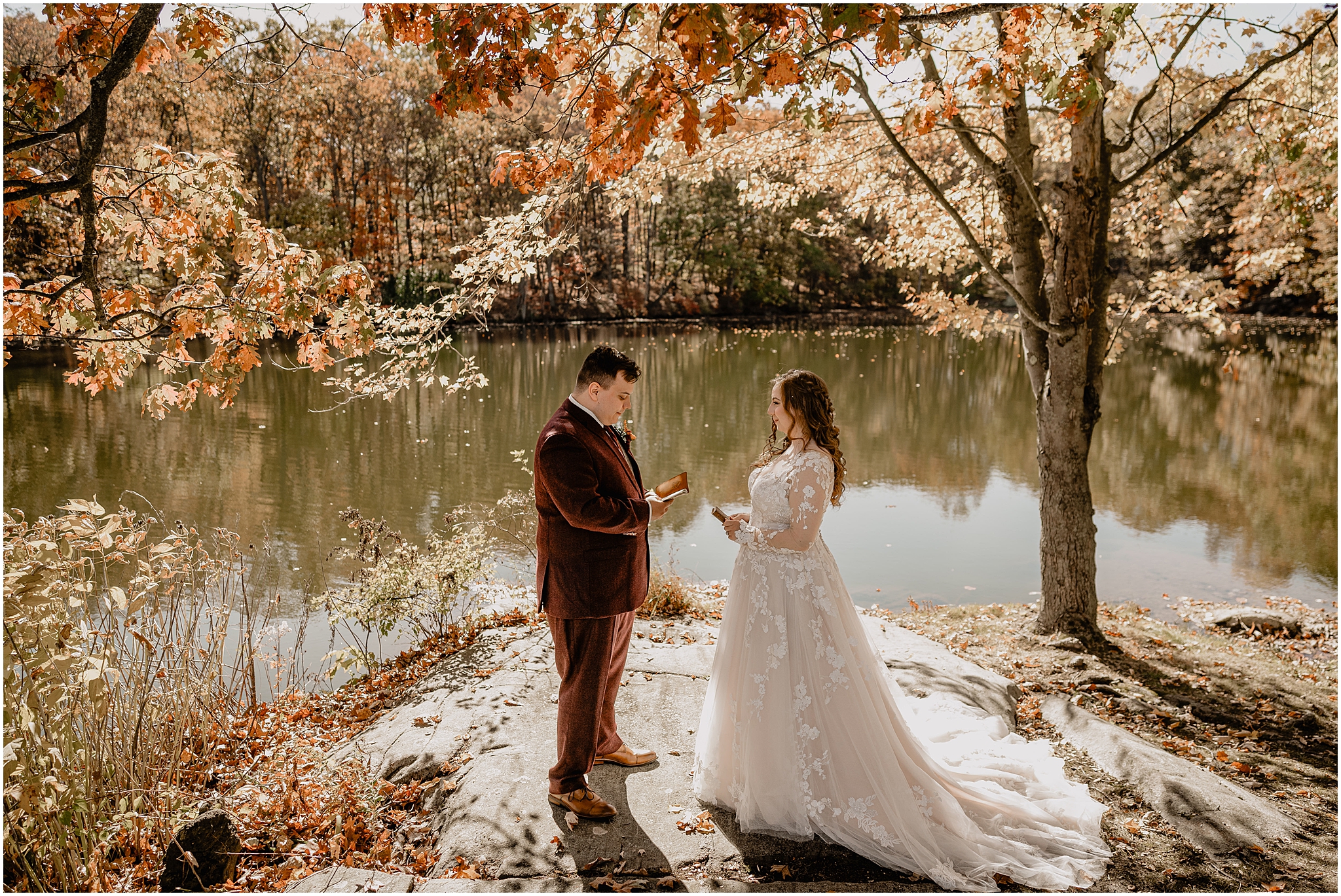 newlyweds read vows privately during first look on rocks outside the Barn at Perona Farms