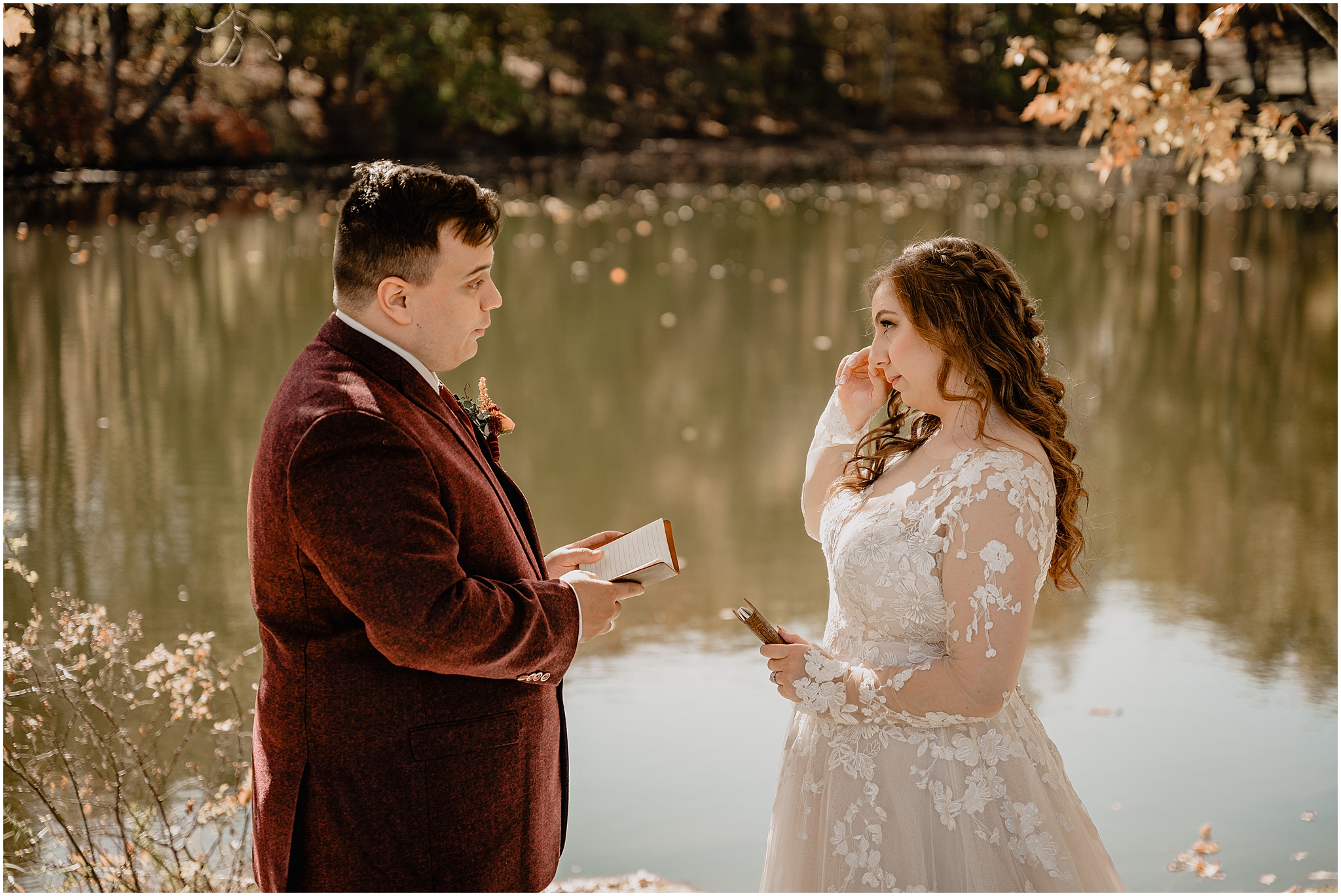 bride and groom read private vows in front of the pond at the Barn at Perona Farms