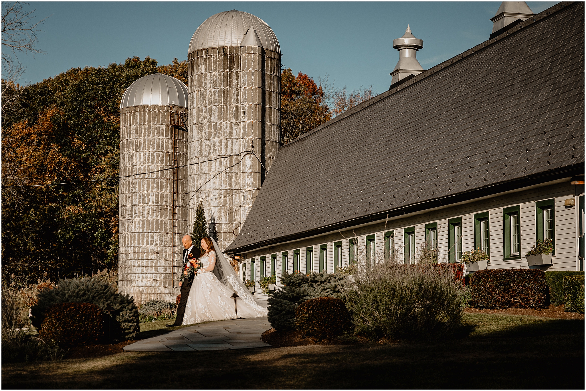 bride and father leave white barn during all wedding day