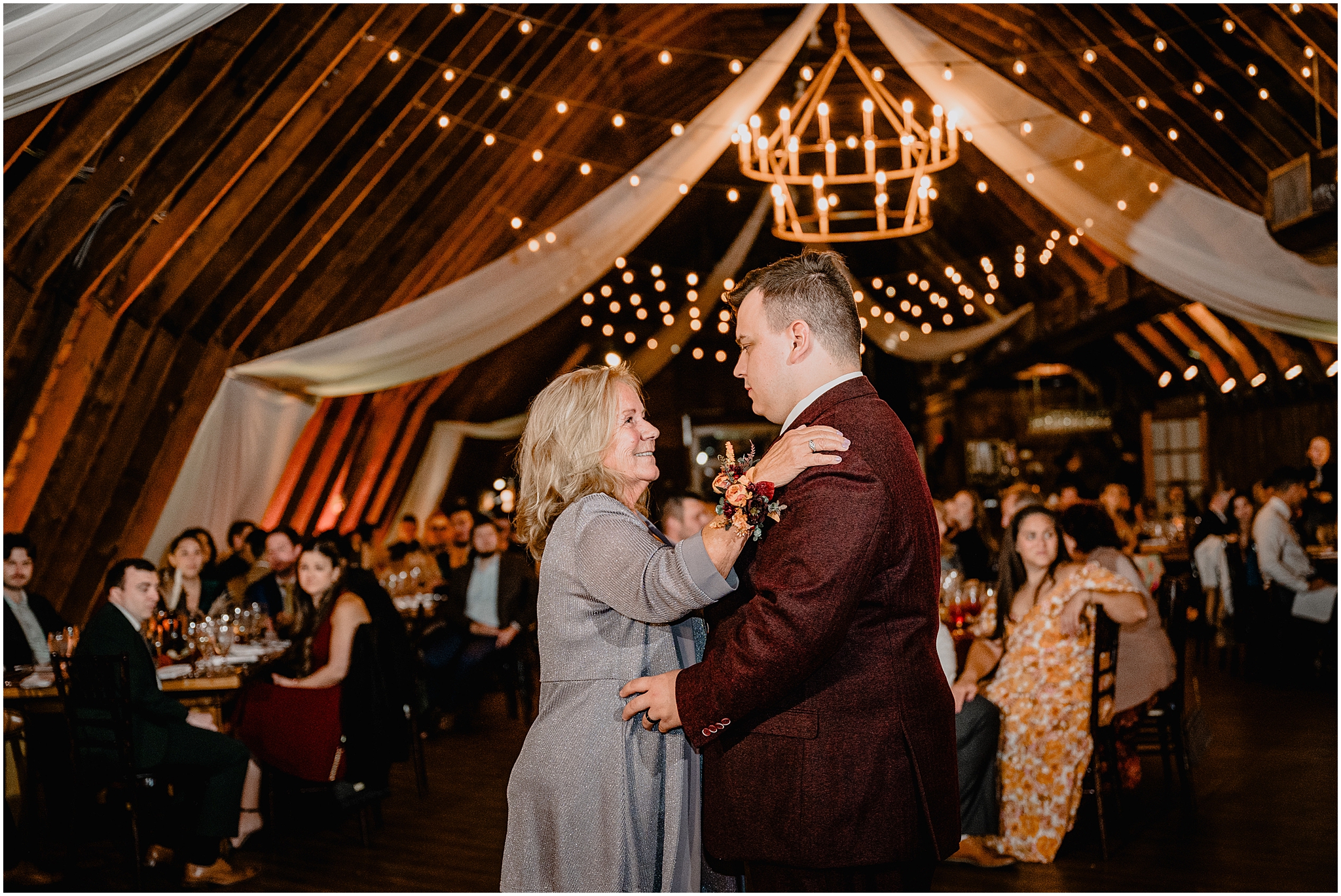 groom dances with mother in barn reception in New Jersey