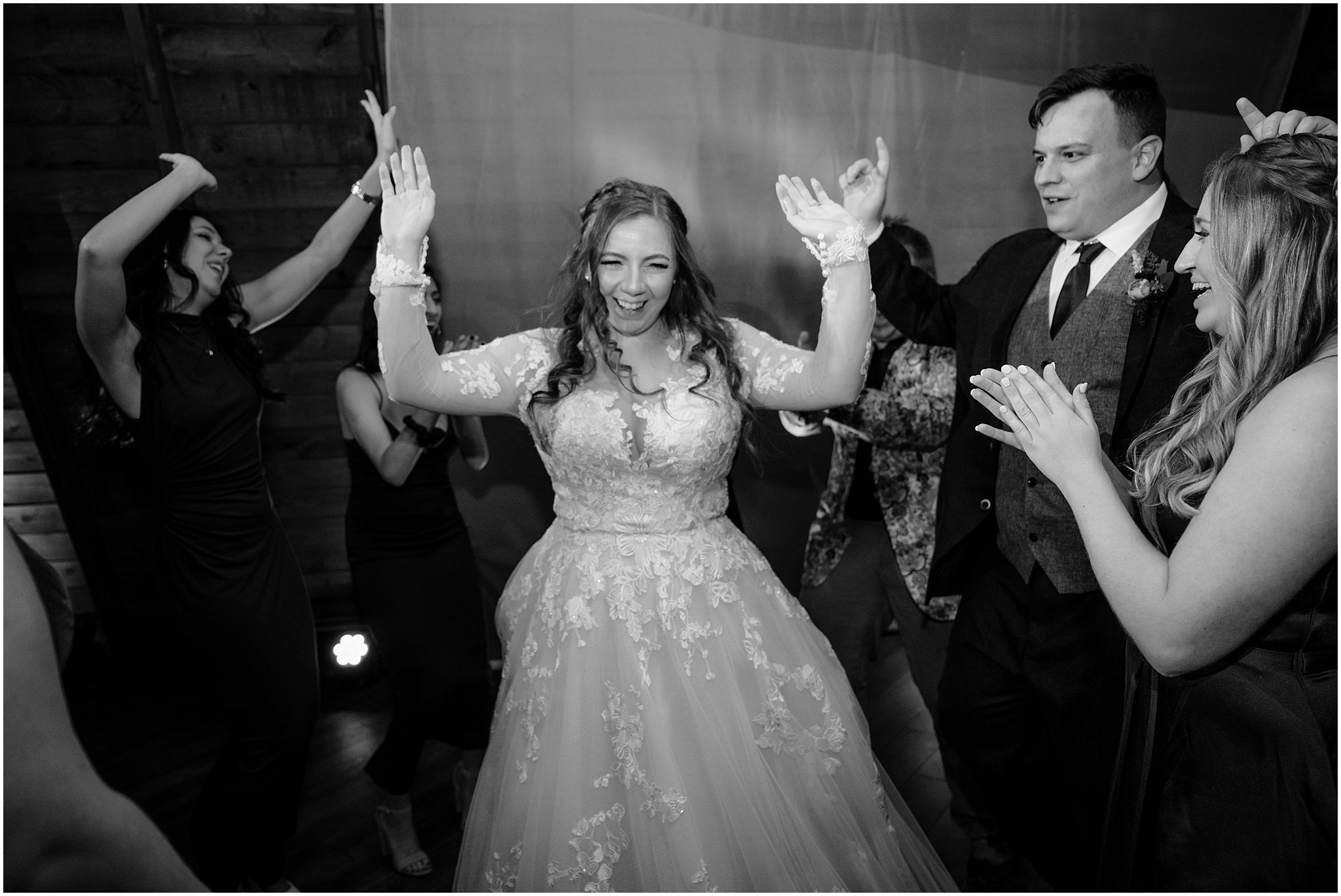bride dances with guests during fall wedding at the Barn at Perona Farms