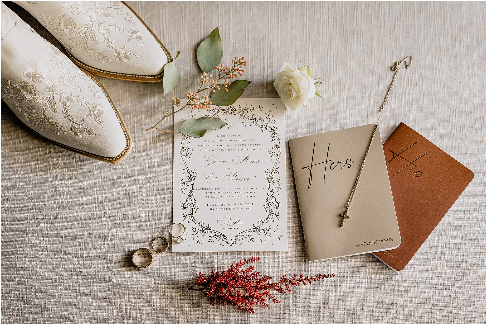 bride's white cowboy boots with invitation suite and his / hers vow booklets