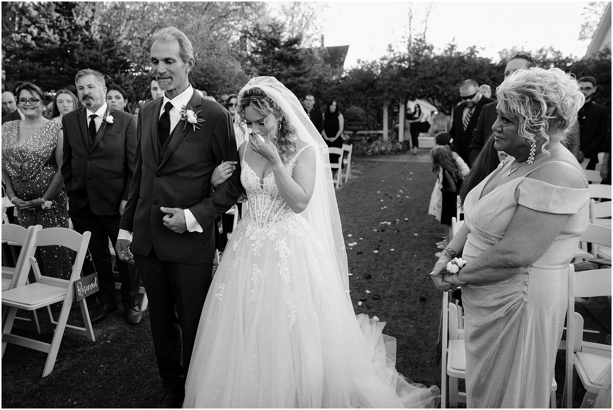 bride cries walking down the aisle with her father at the Feast at Round Hill