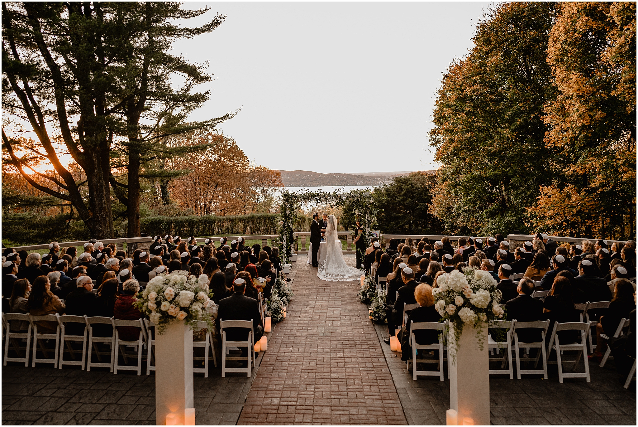 Jewish wedding ceremony on the patio at Tappan Hill Mansion overlooking the water