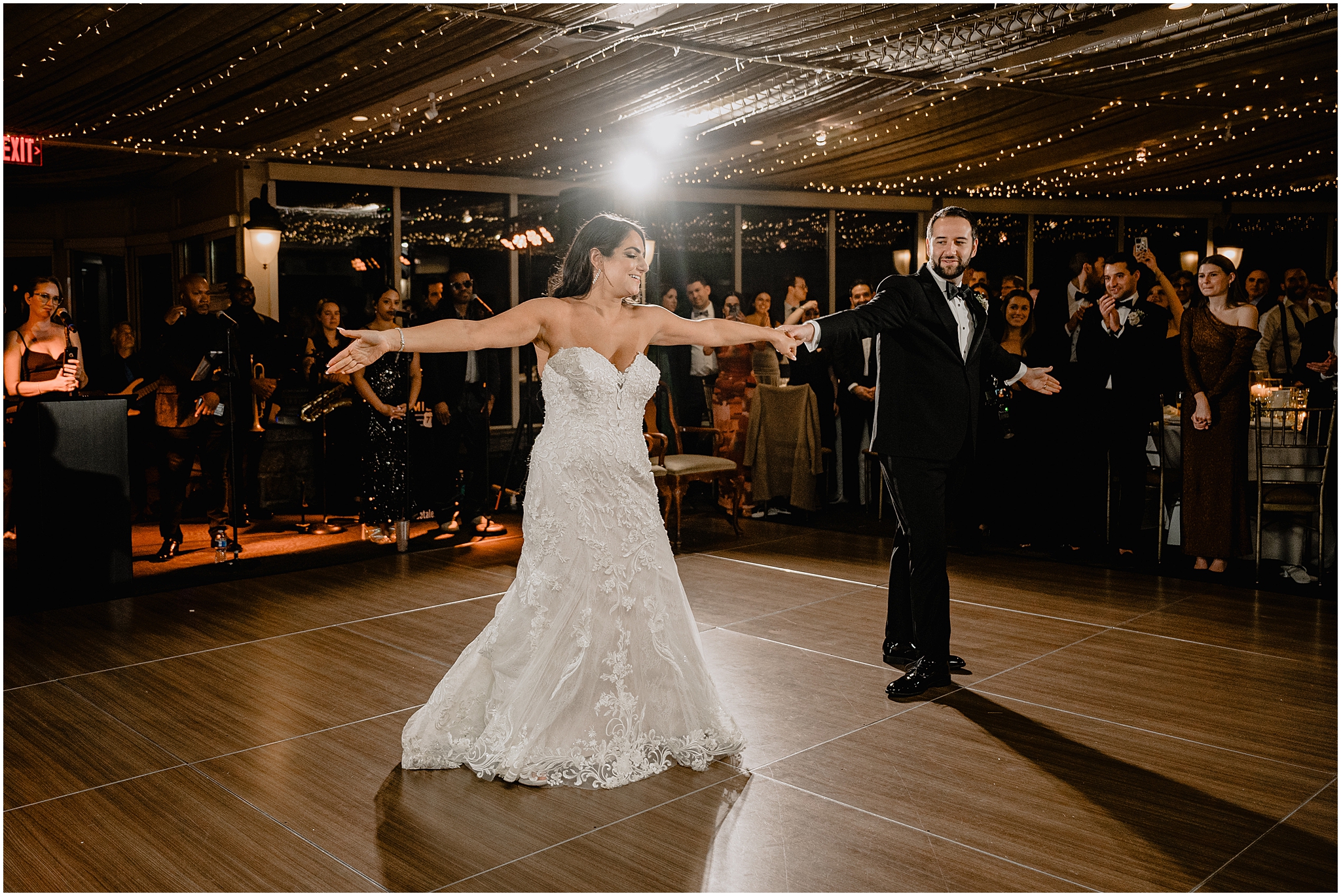 groom twirls bride out on the dance floor during Tarrytown NY wedding reception