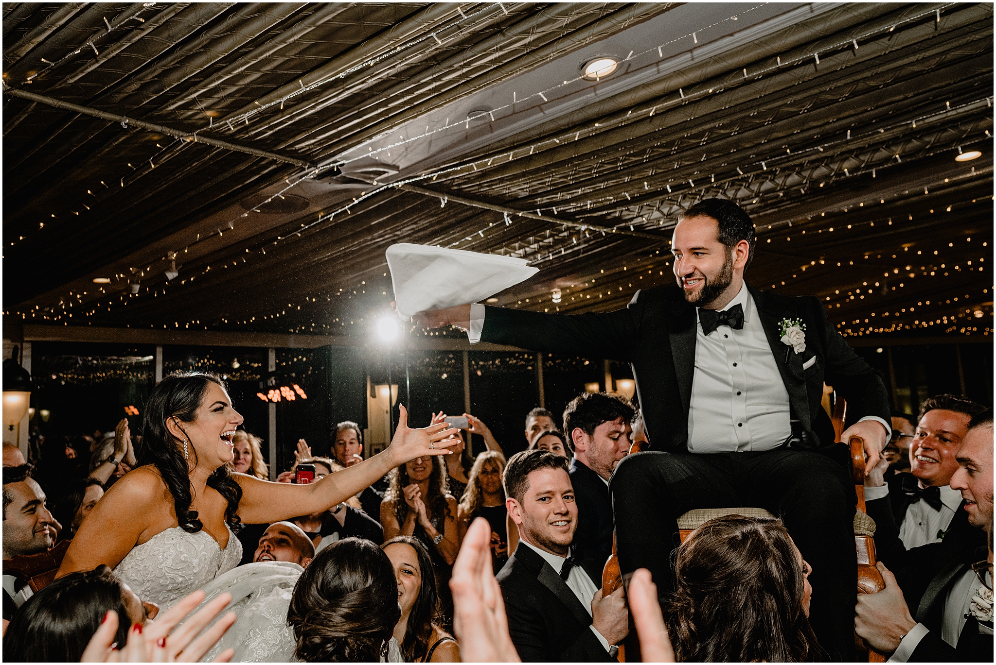 bride and groom complete hora during Tarrytown NY wedding reception