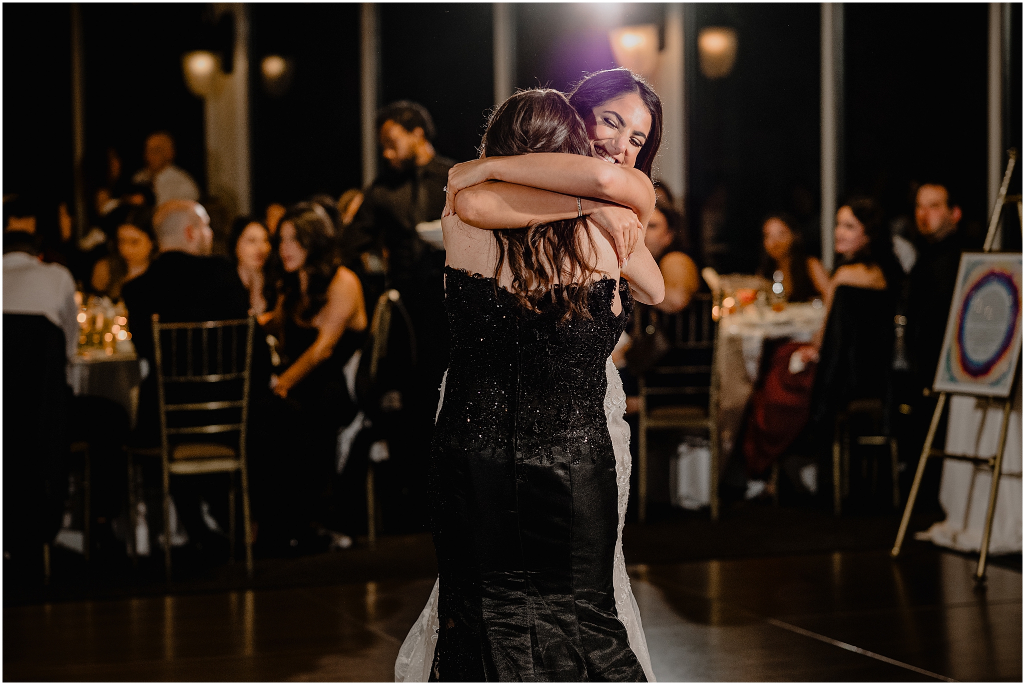 bride hugs mother on dance floor during Tarrytown NY wedding reception 