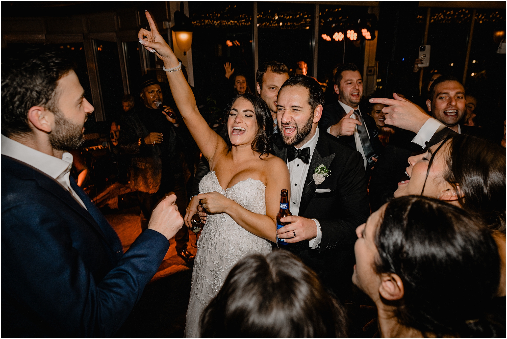 bride and groom dance in circle of guests at Tarrrytown NY wedding reception