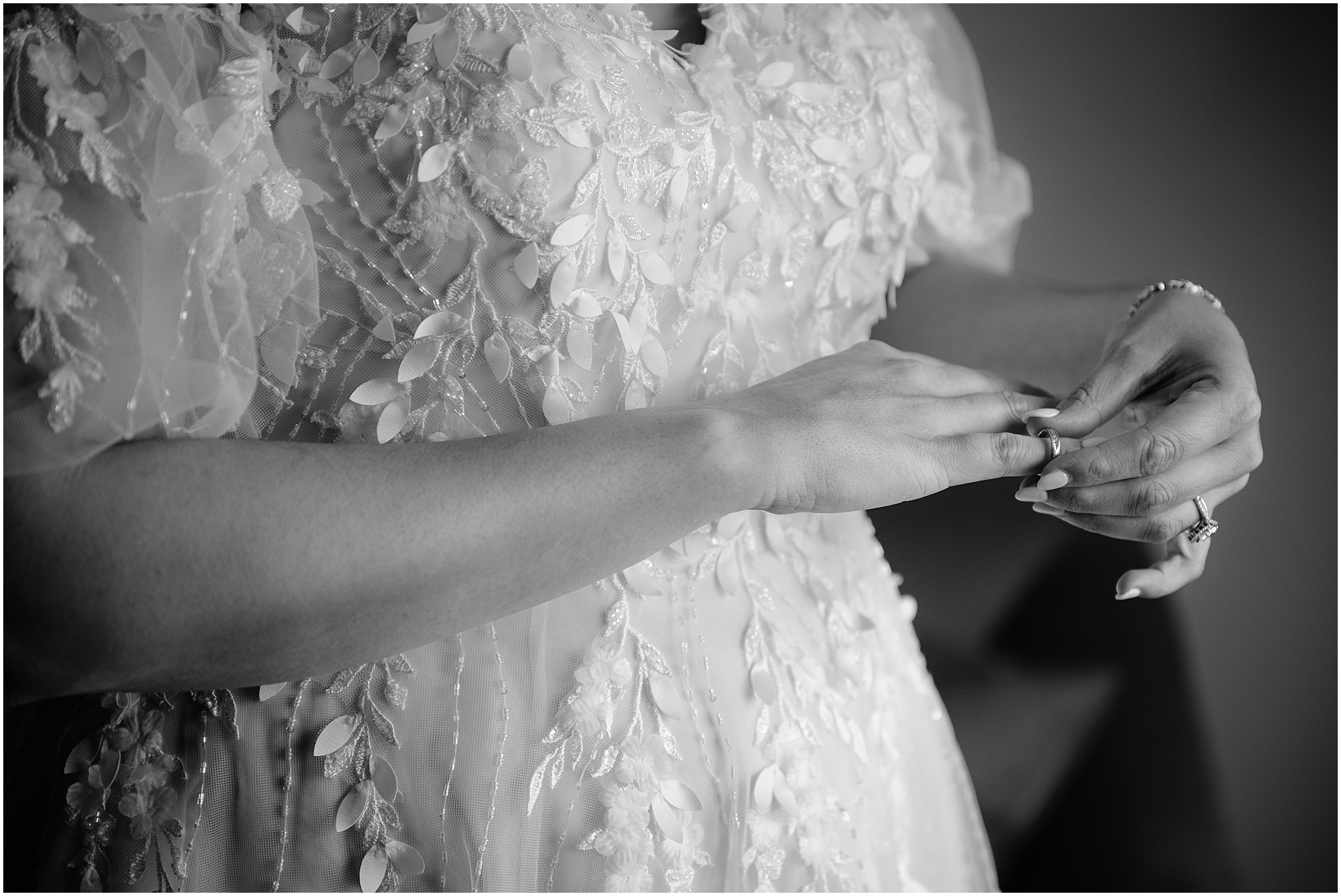 bride adjusts ring on finger during prep for wedding day
