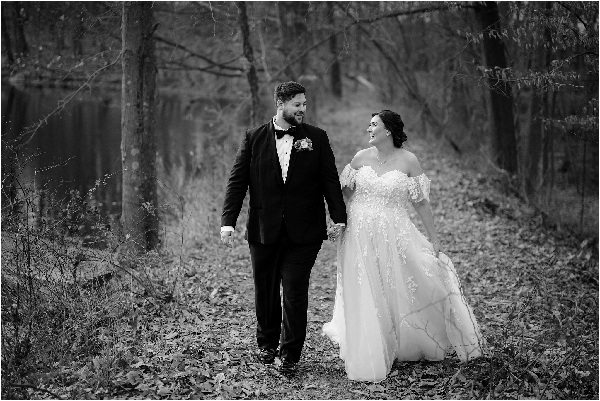 bride and groom hold hands walking through woods at the Perona Farms Reserve