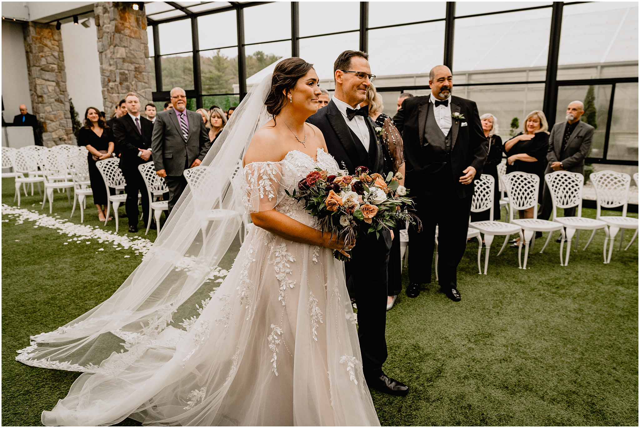 bride begins to cry during wedding ceremony in the atrium at Perona Farms Reserve