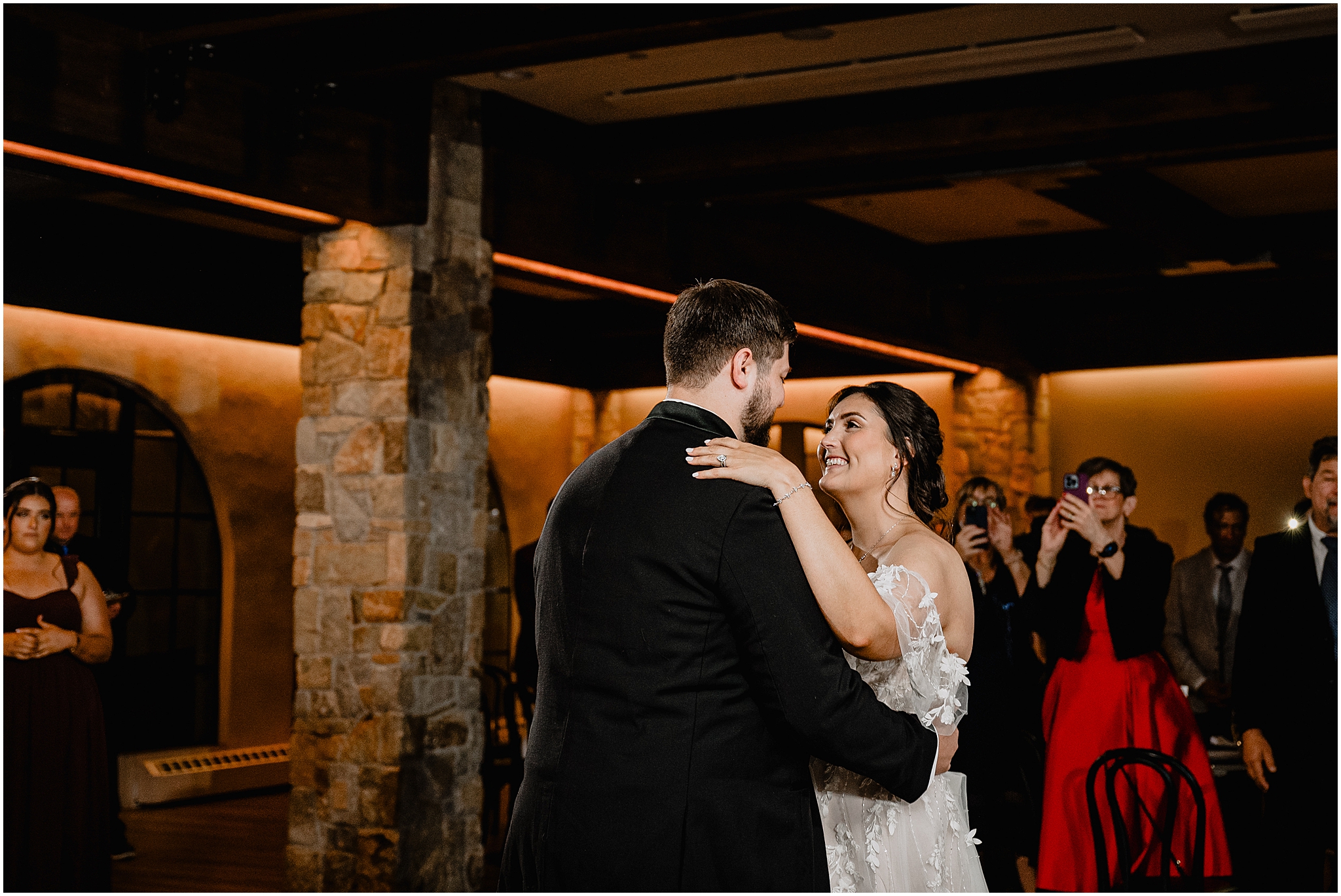 bride smiles up at groom during first dance at Andover NJ wedding reception