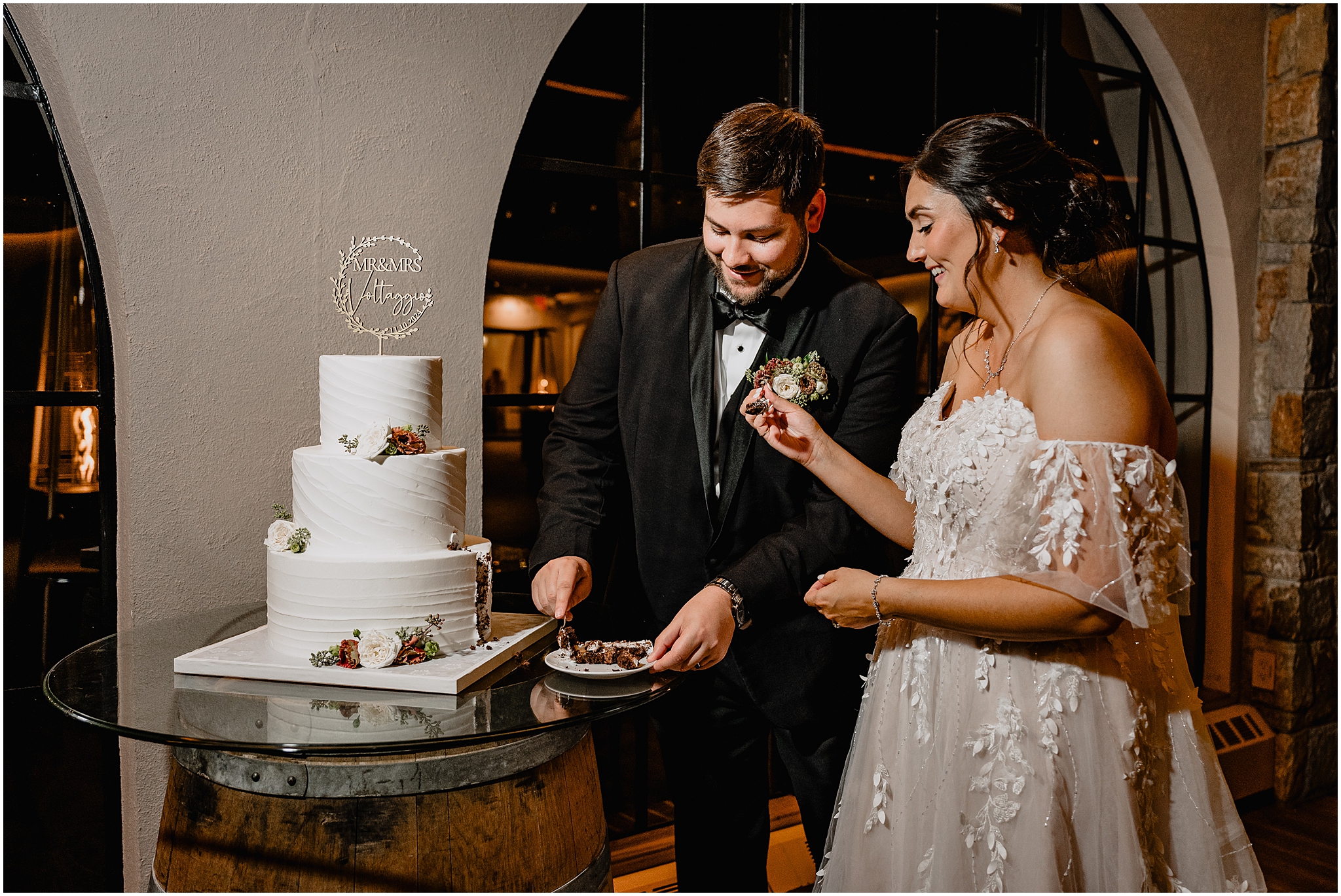 newlyweds taste wedding cake during Andover NJ wedding reception
