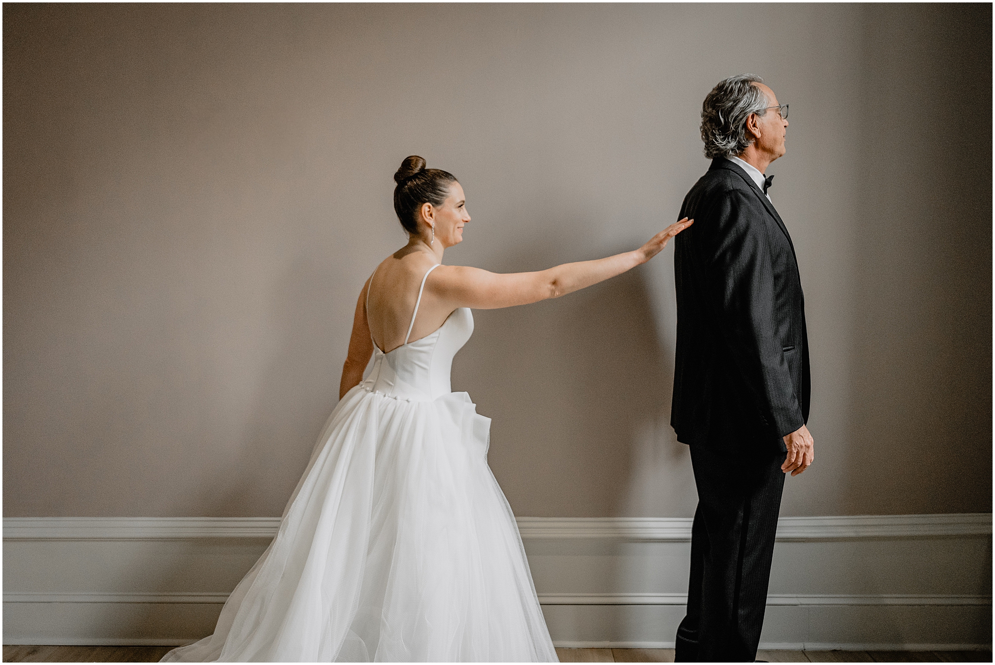 bride reaches for dad during first look inside Philadelphia hotel