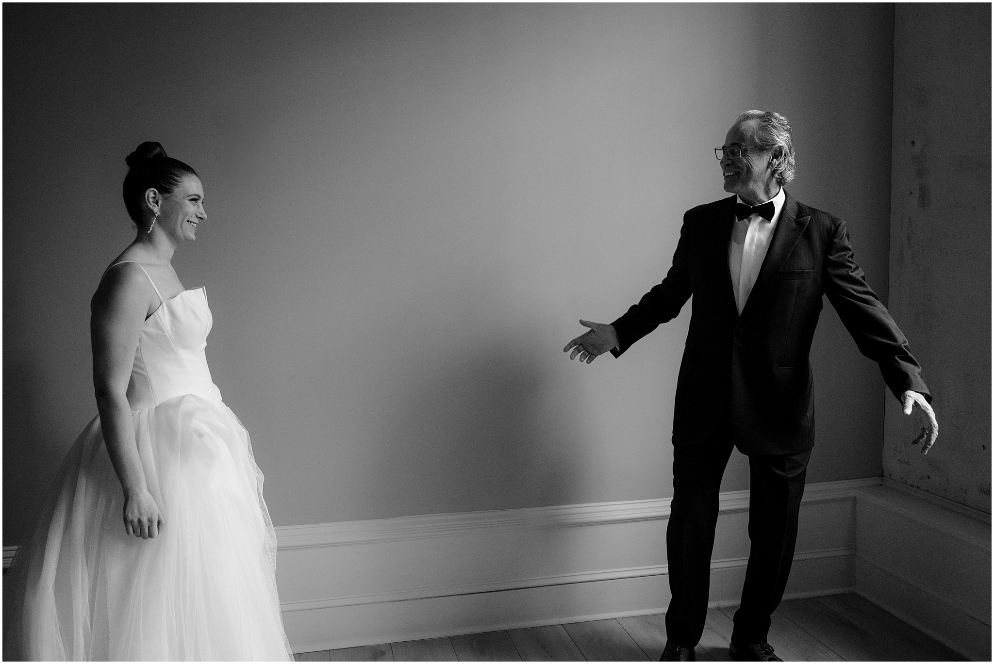 groom turns to look at bride during first look inside Philly hotel 