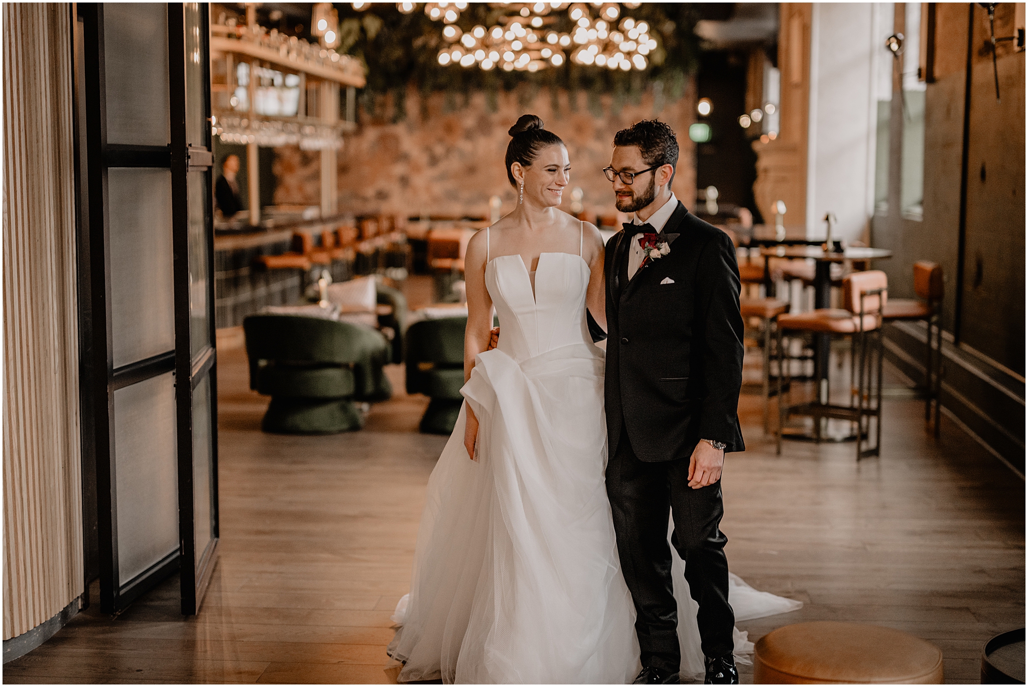 newlyweds walk through lobby of Cescaphe's Switch House in Philadelphia PA