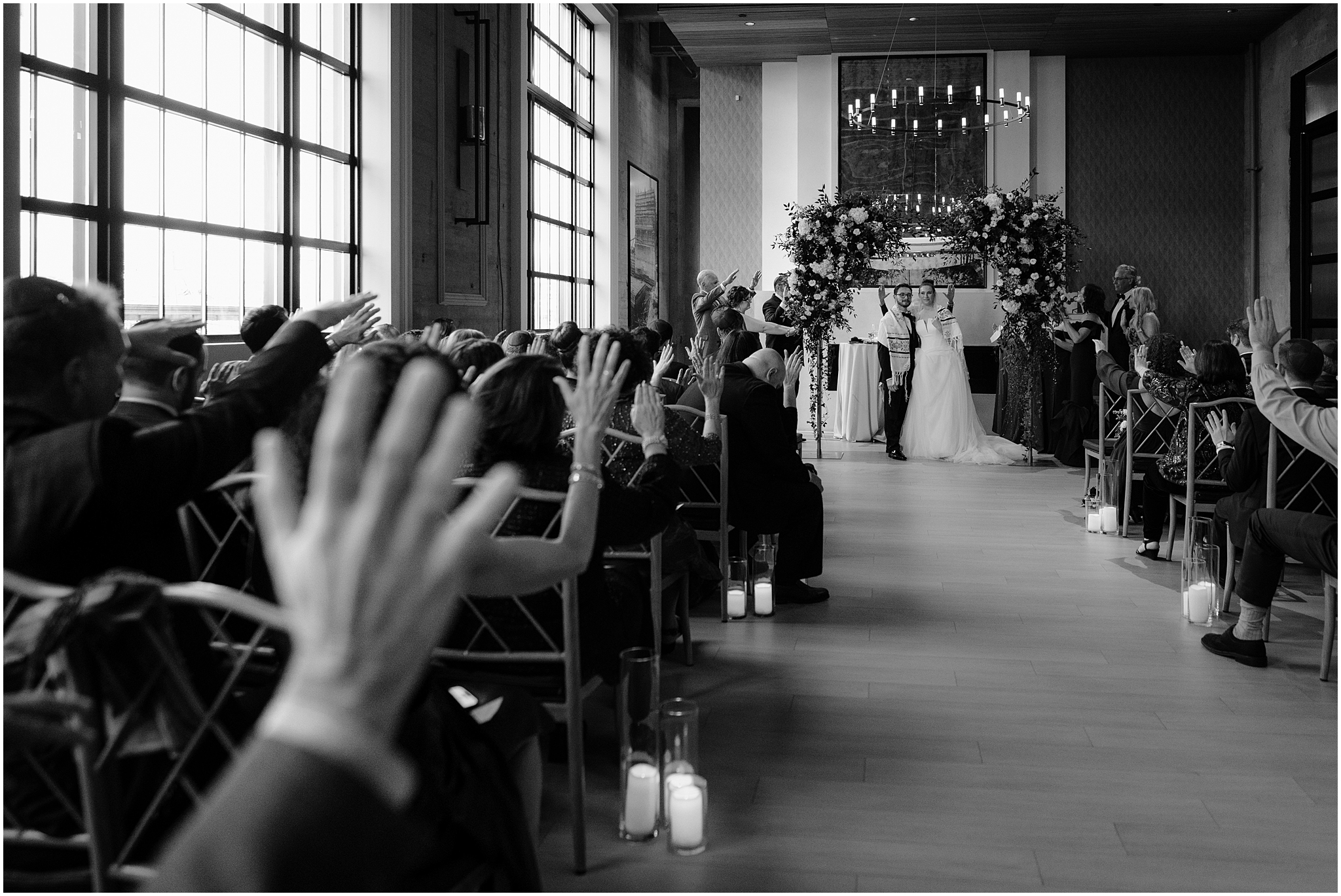 newlyweds stand with prayer shawl around Jewish wedding ceremony inside Cescaphe's Switch House in Philadelphia PA