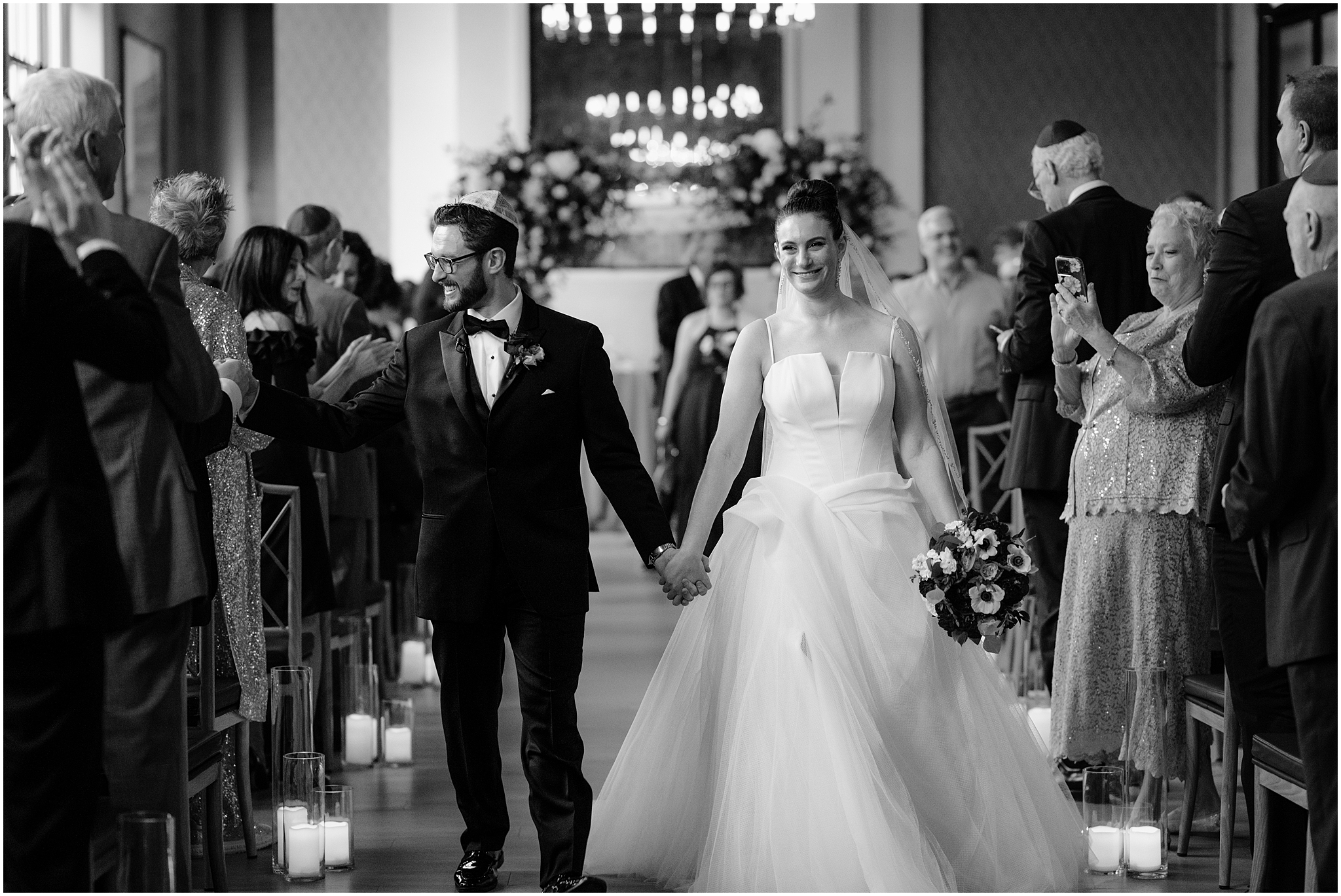 bride and groom walk up aisle during Jewish wedding ceremony inside Cescaphe's Switch House in Philadelphia PA