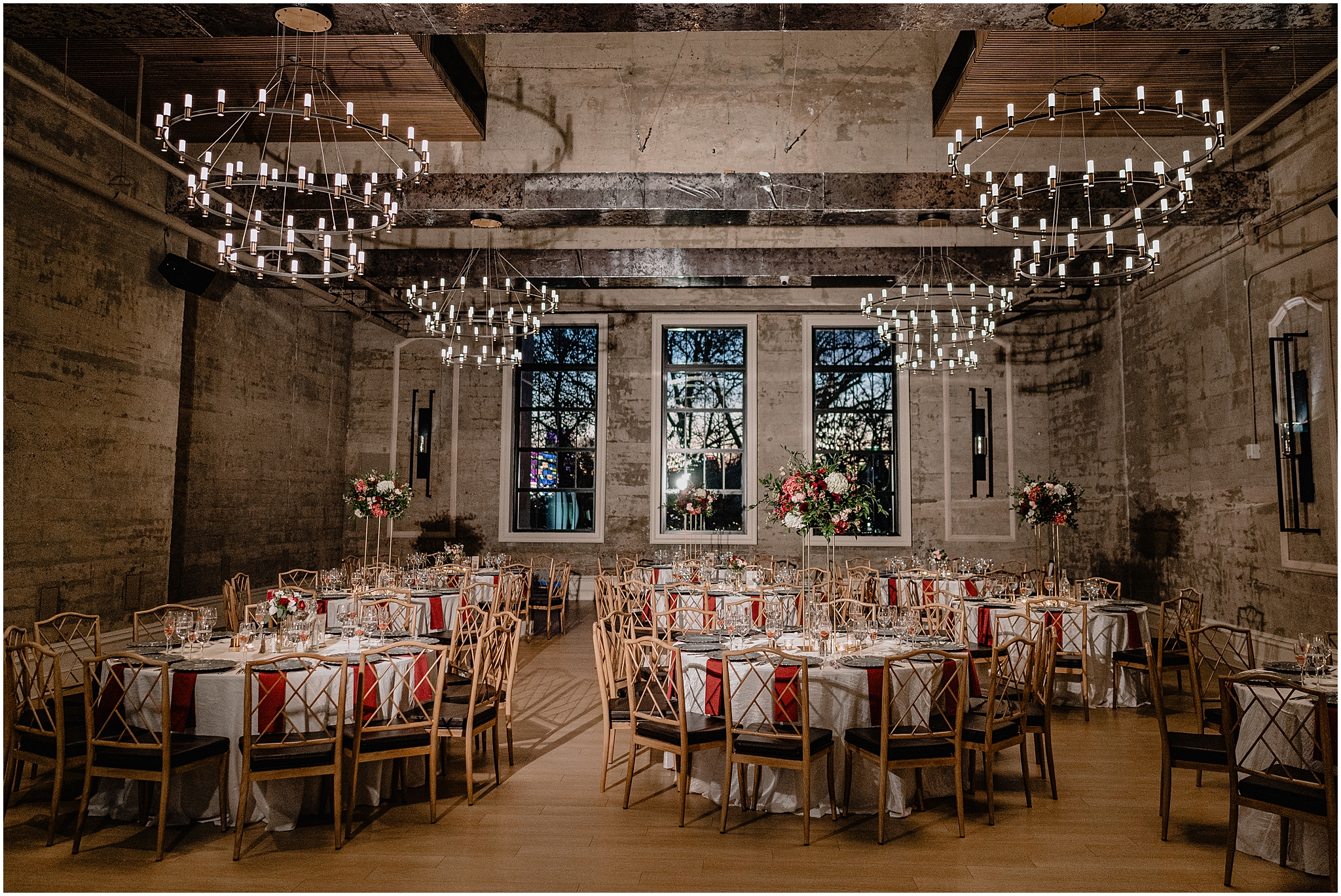 fall wedding reception with burgundy napkins and gold chivari chairs at Cescaphe's Switch House