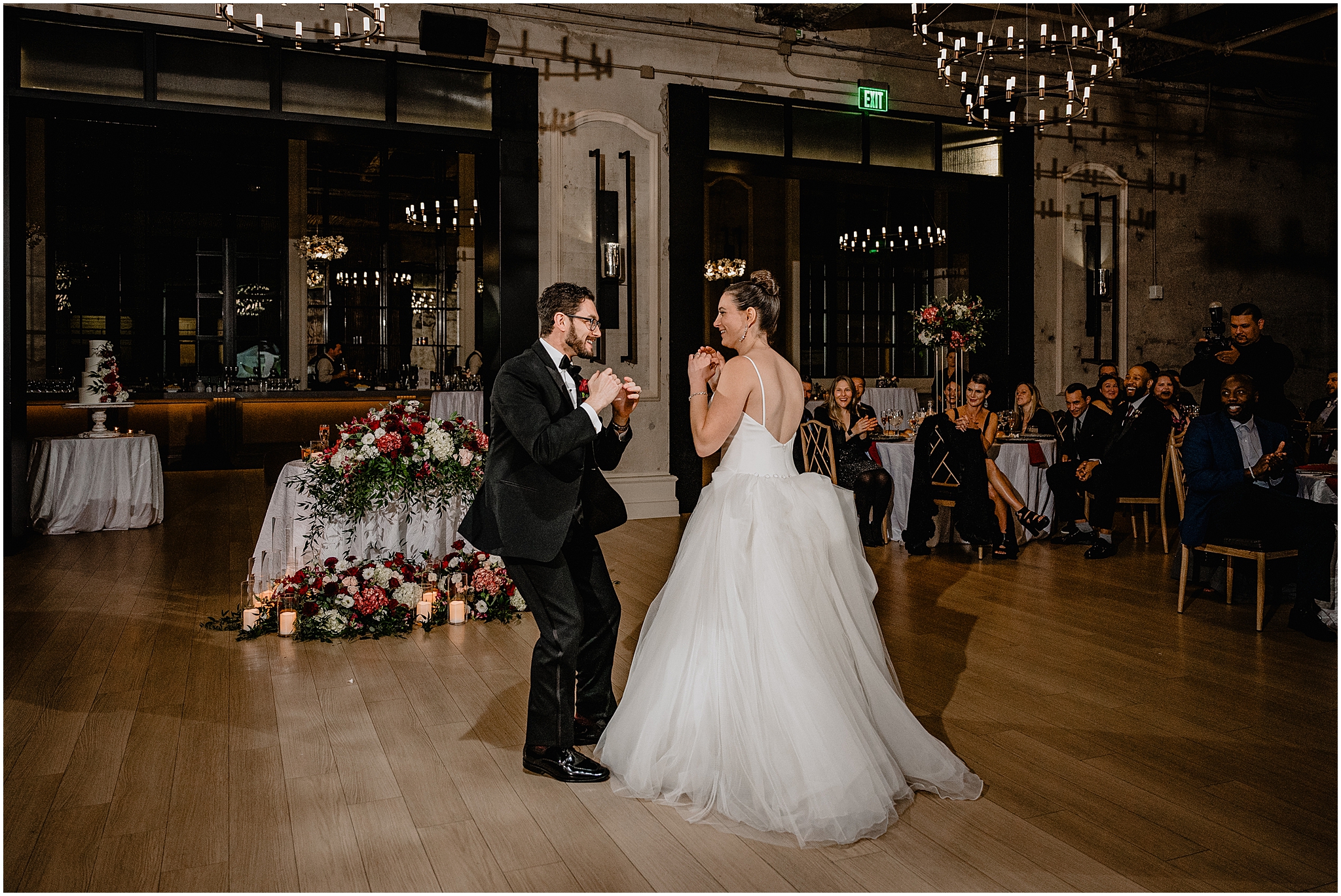 bride and groom dance together during Philadelphia PA wedding reception in the ballroom