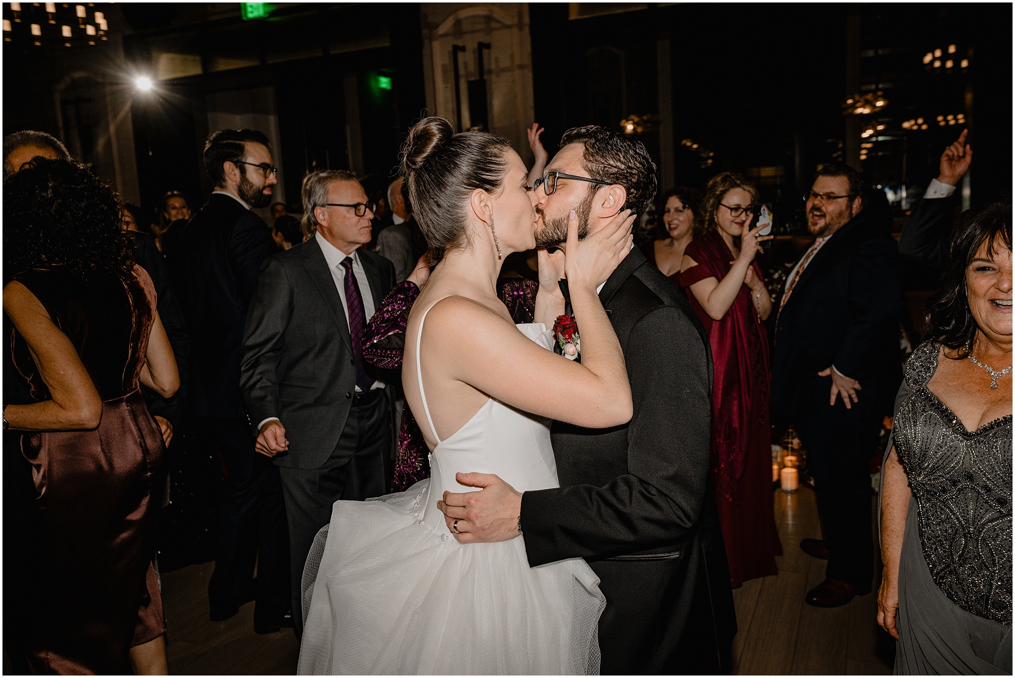 bride and groom kiss on dance floor during Philadelphia PA wedding reception in the ballroom