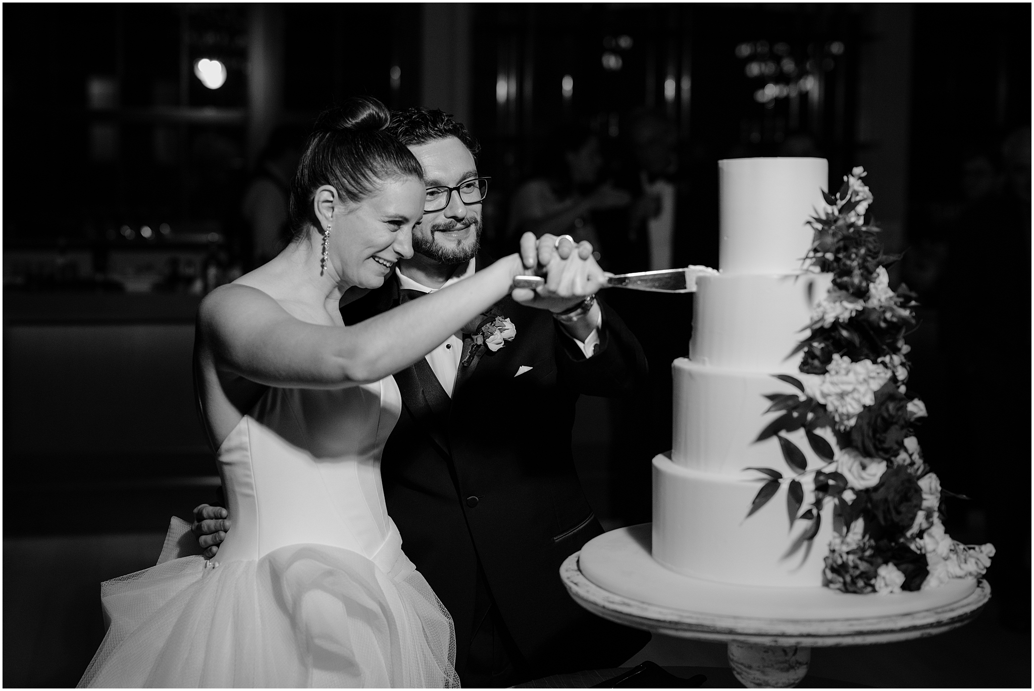 bride and groom cut wedding cake during Philadelphia PA wedding reception