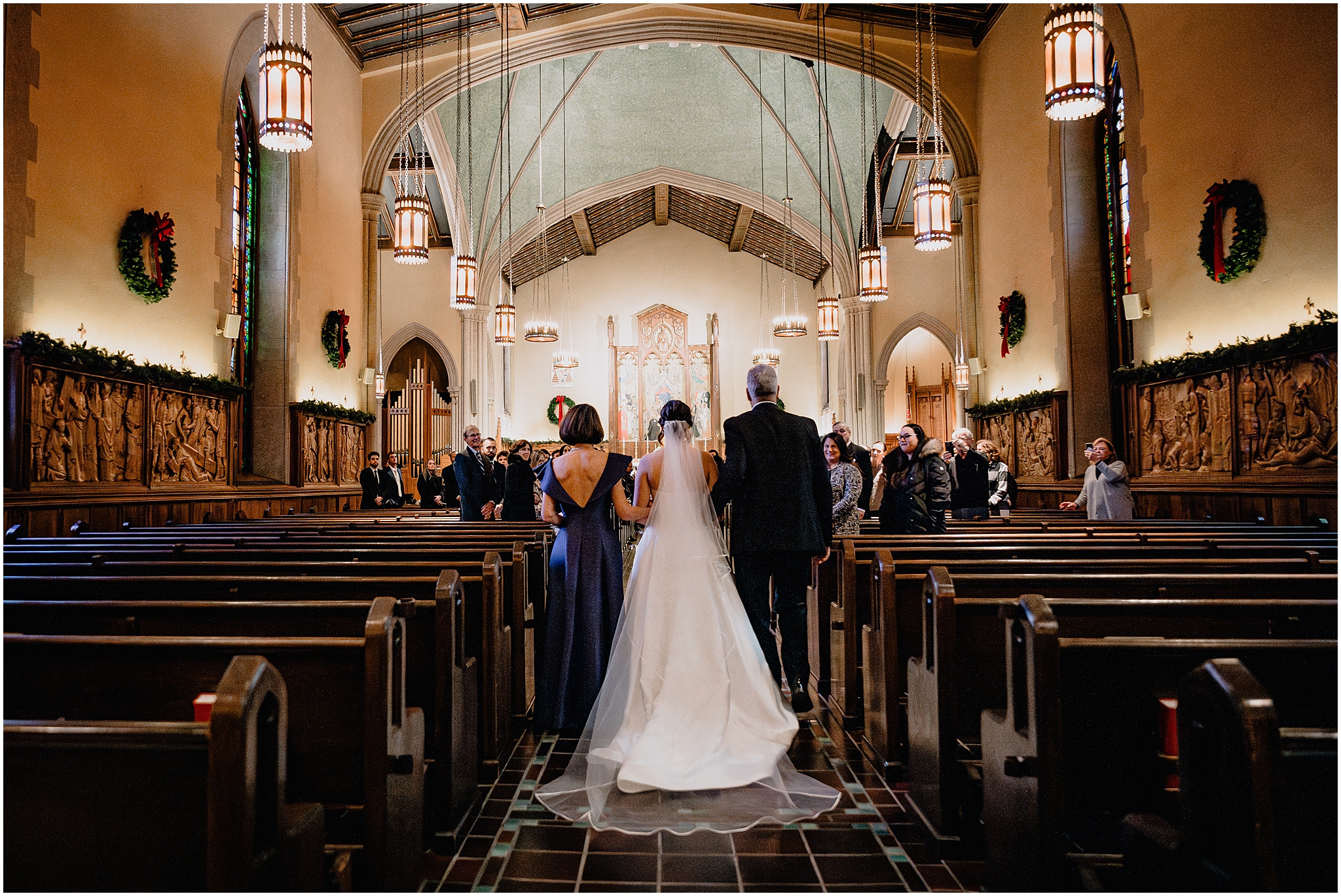bride walks down aisle inside New York church for traditional wedding ceremony