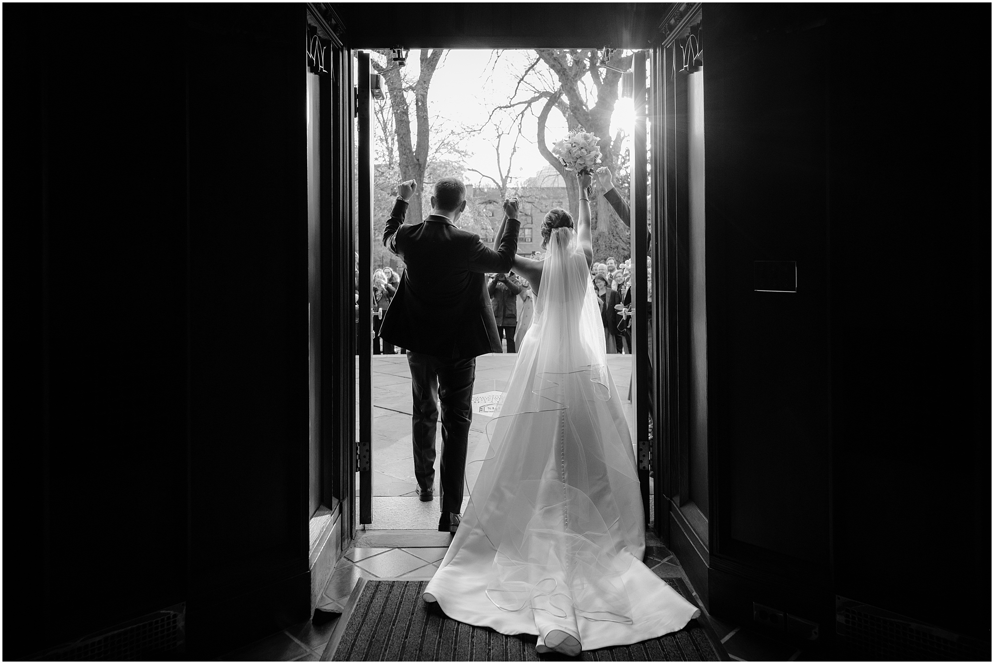 newlyweds cheer leaving traditional Catholic wedding ceremony inside New York Church