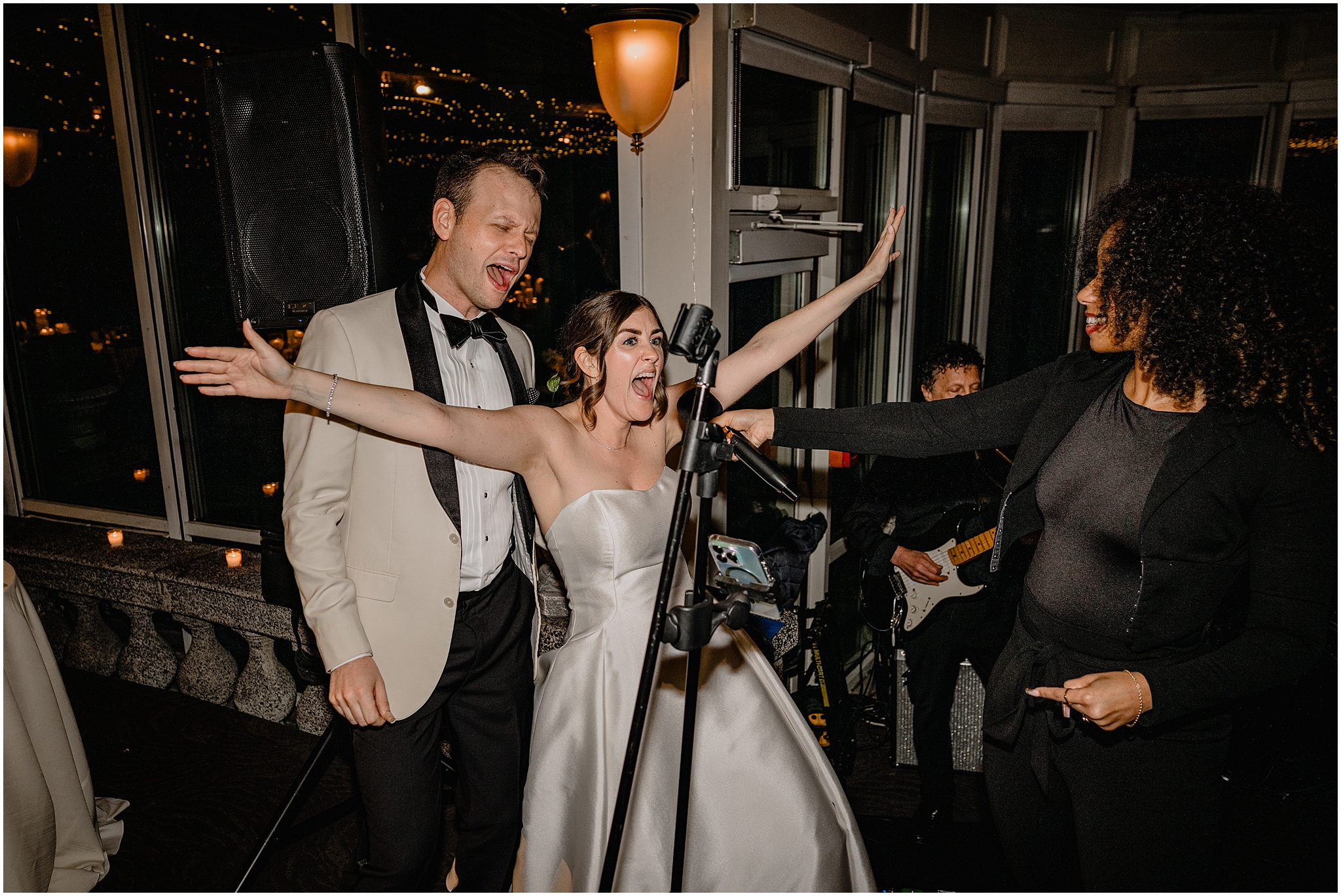 bride and groom sing into microphone at Tarrytown NY wedding reception