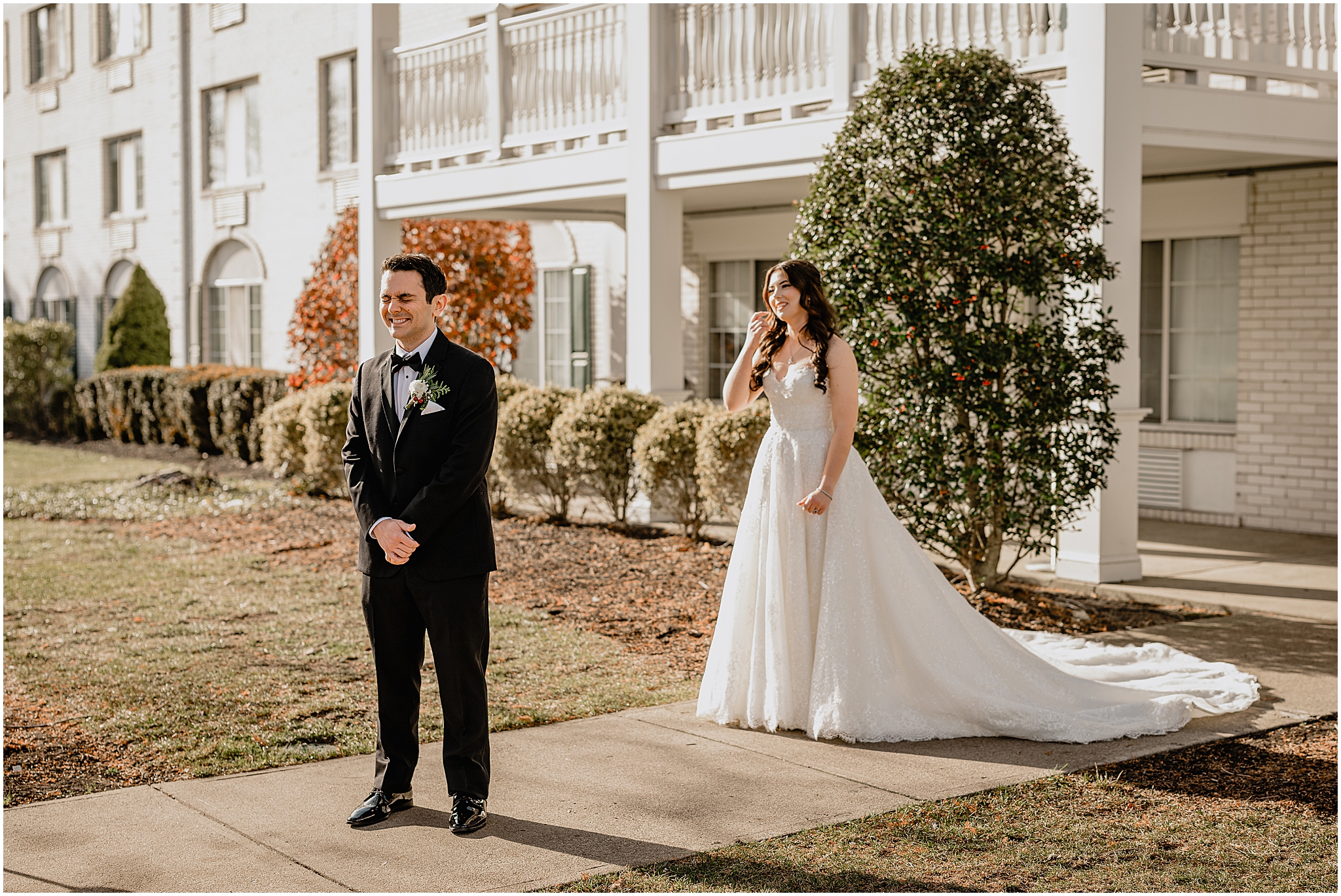 bride approaches groom outside hotel for first look in New Jersey