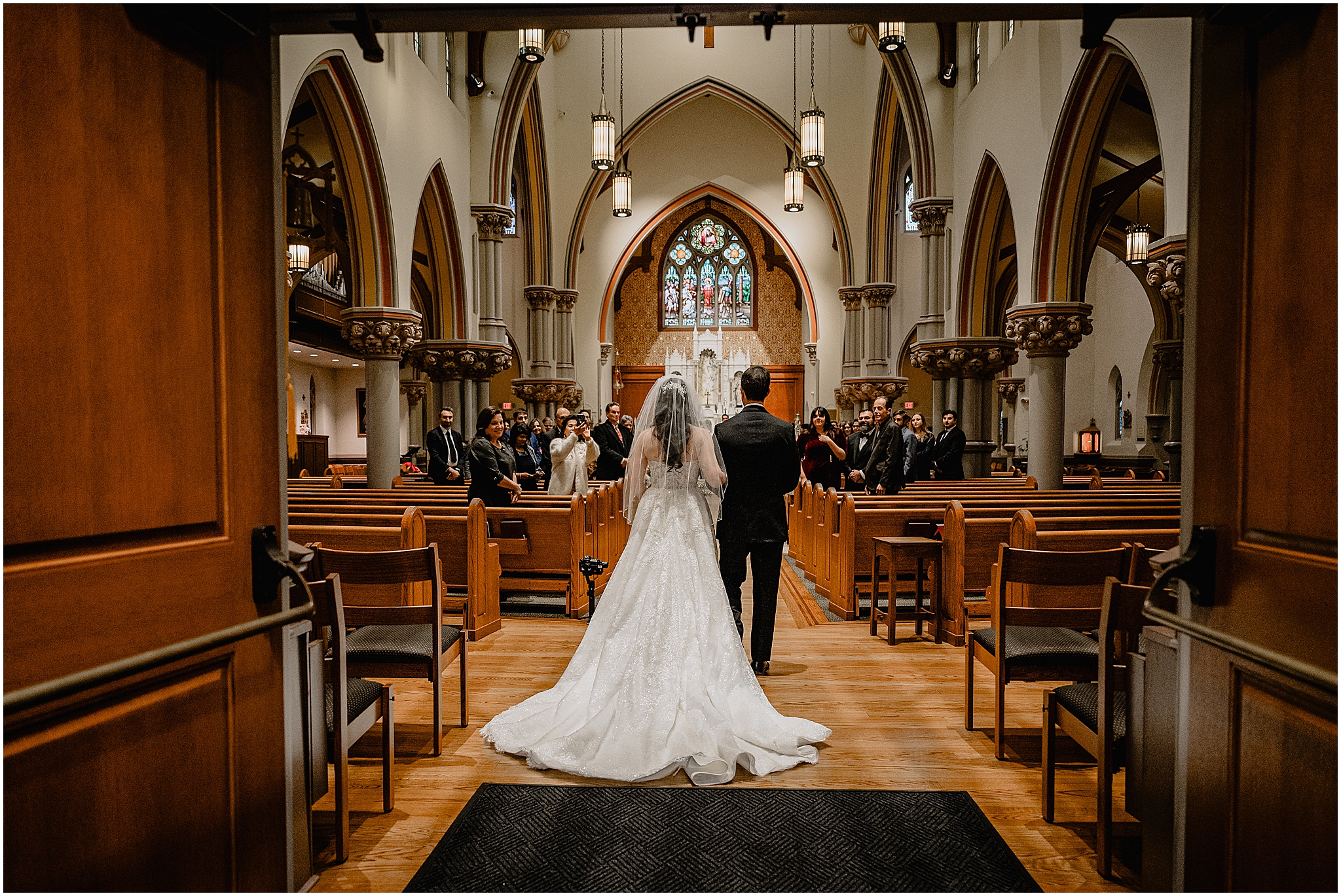 bride and father walk down aisle inside historic church in New Jersey