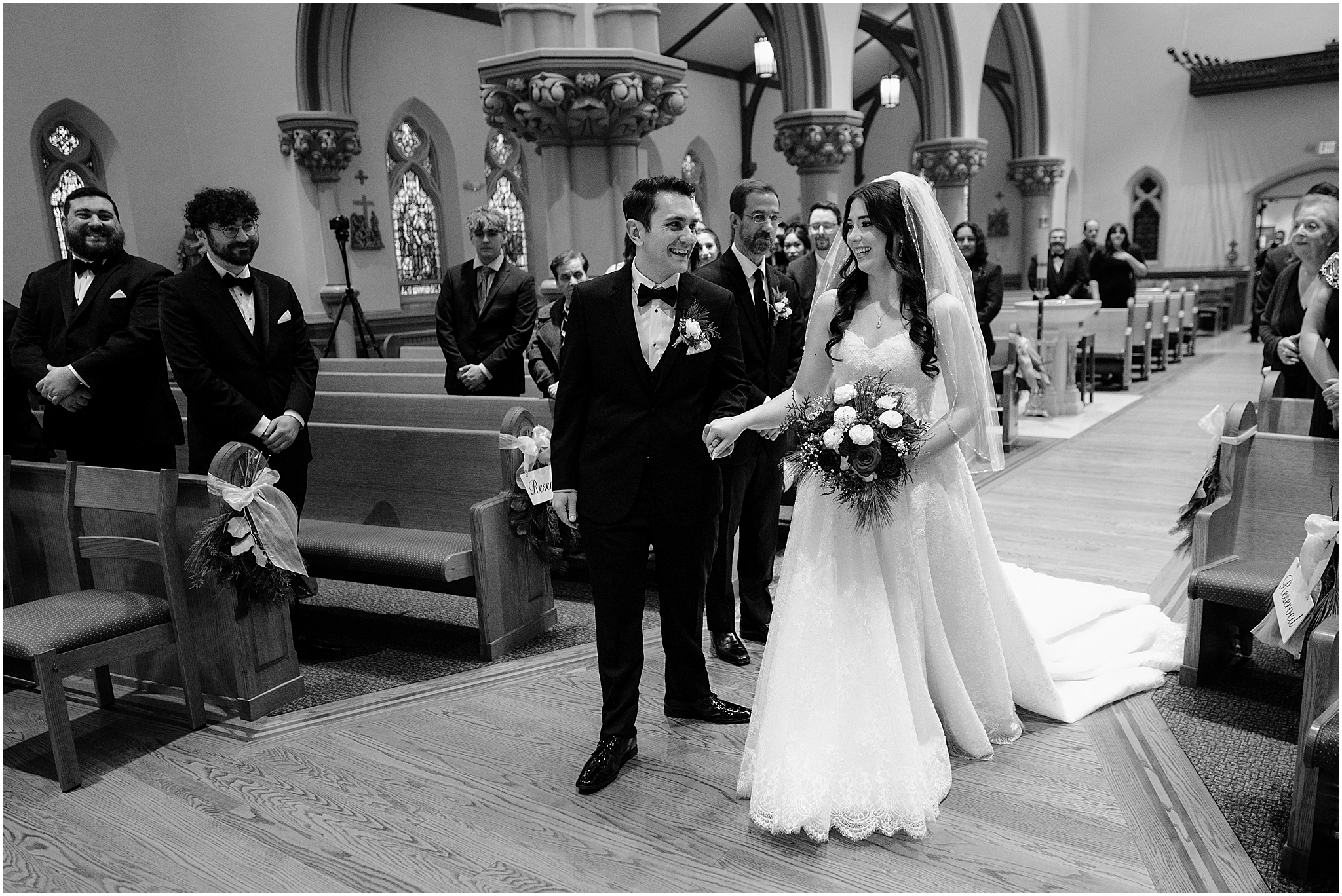 bride and groom walk up towards alter inside historic church in New Jersey