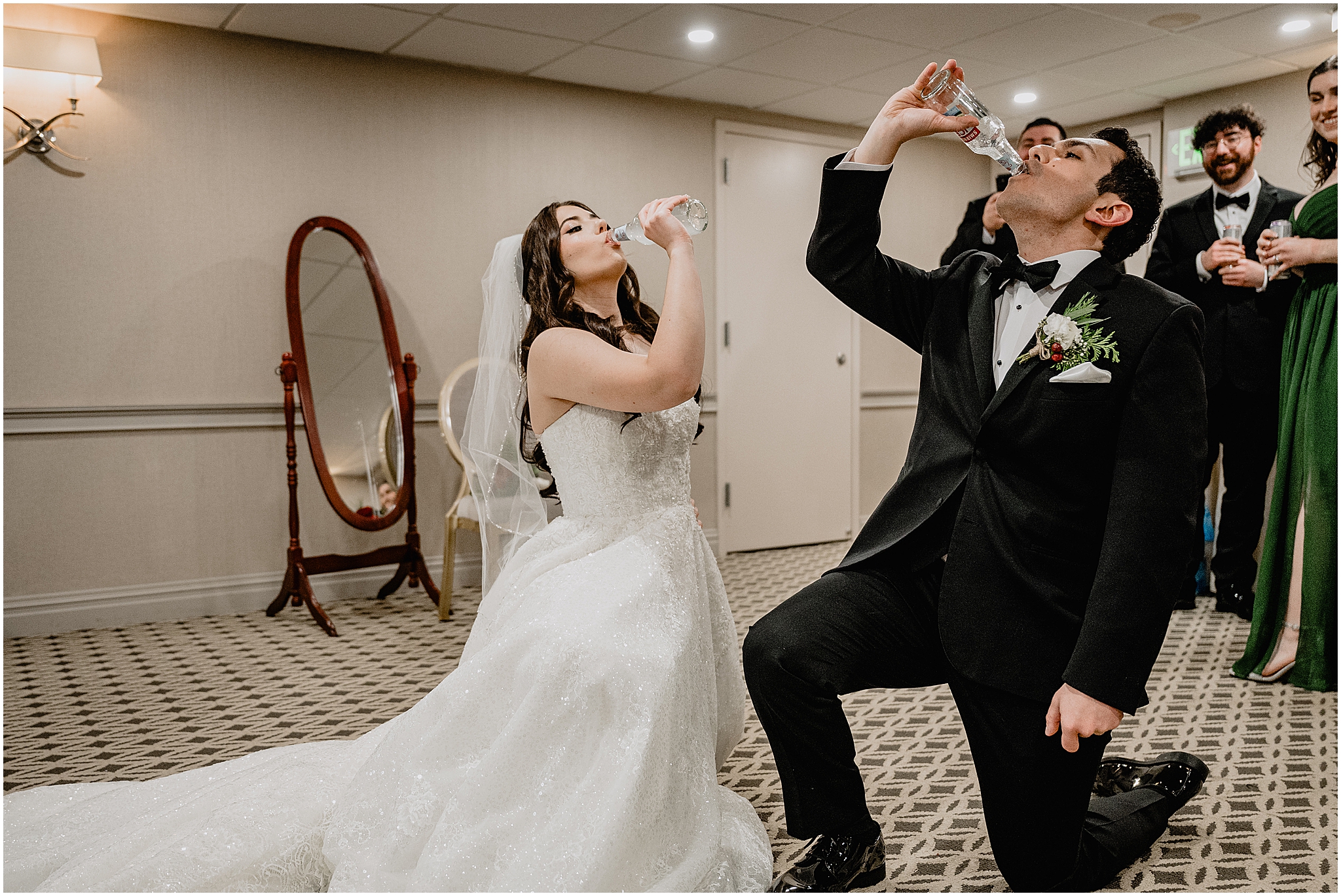 newlyweds drink Smirnoff ice during wedding day inside the Madison Hotel