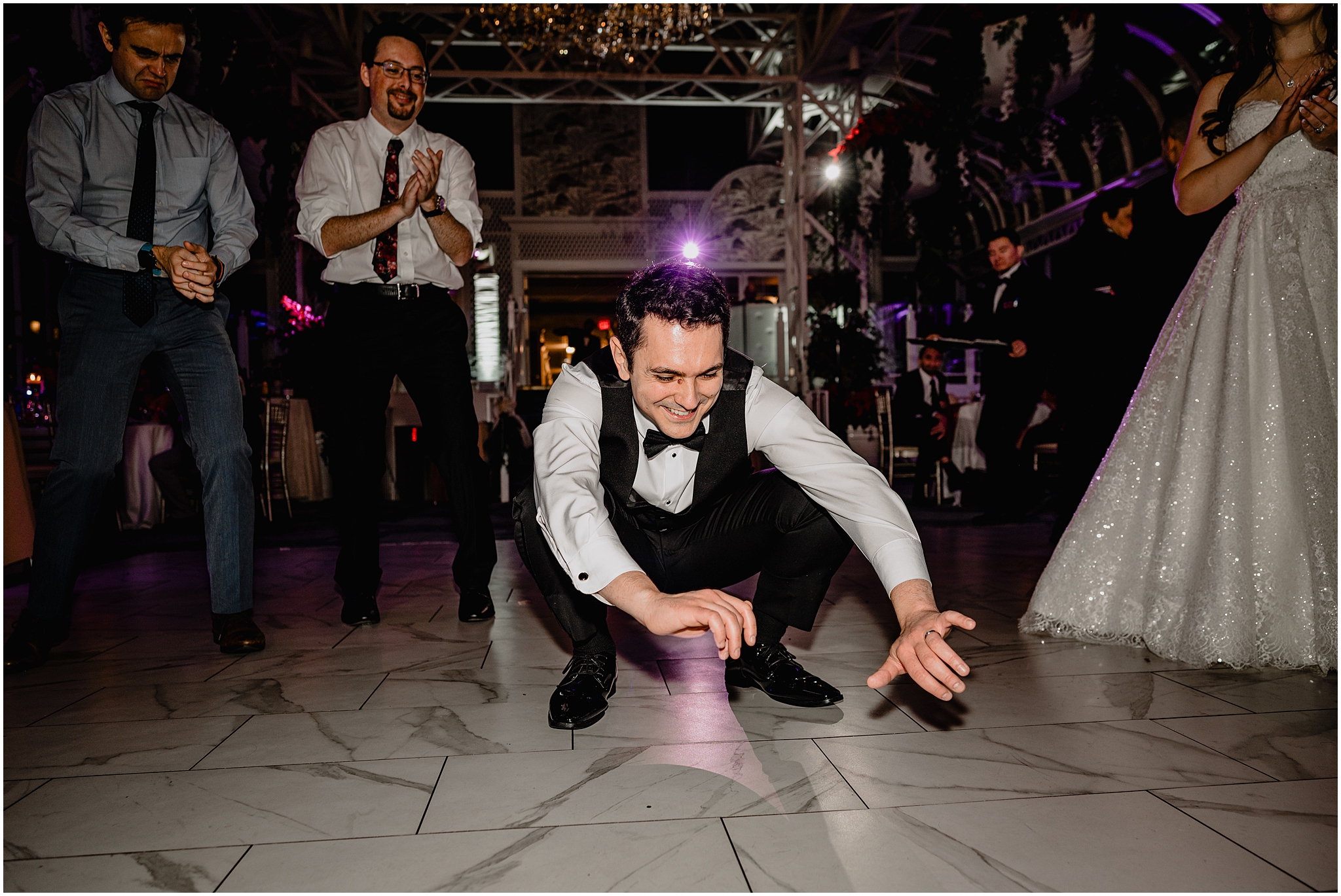 groom dances low to the ground during wedding reception in Morristown NJ