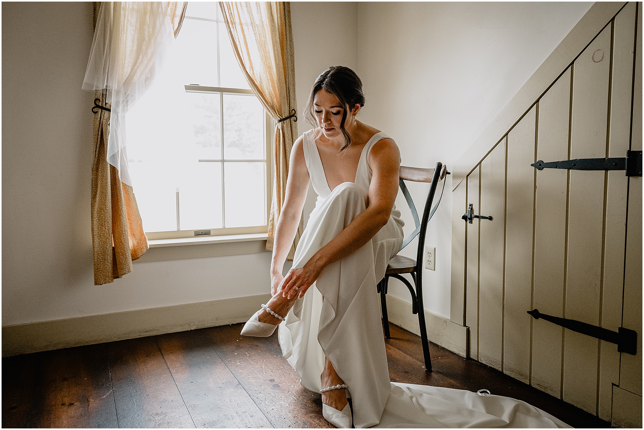 Bride getting ready before her winter wedding at The Barn at Perona Farms.