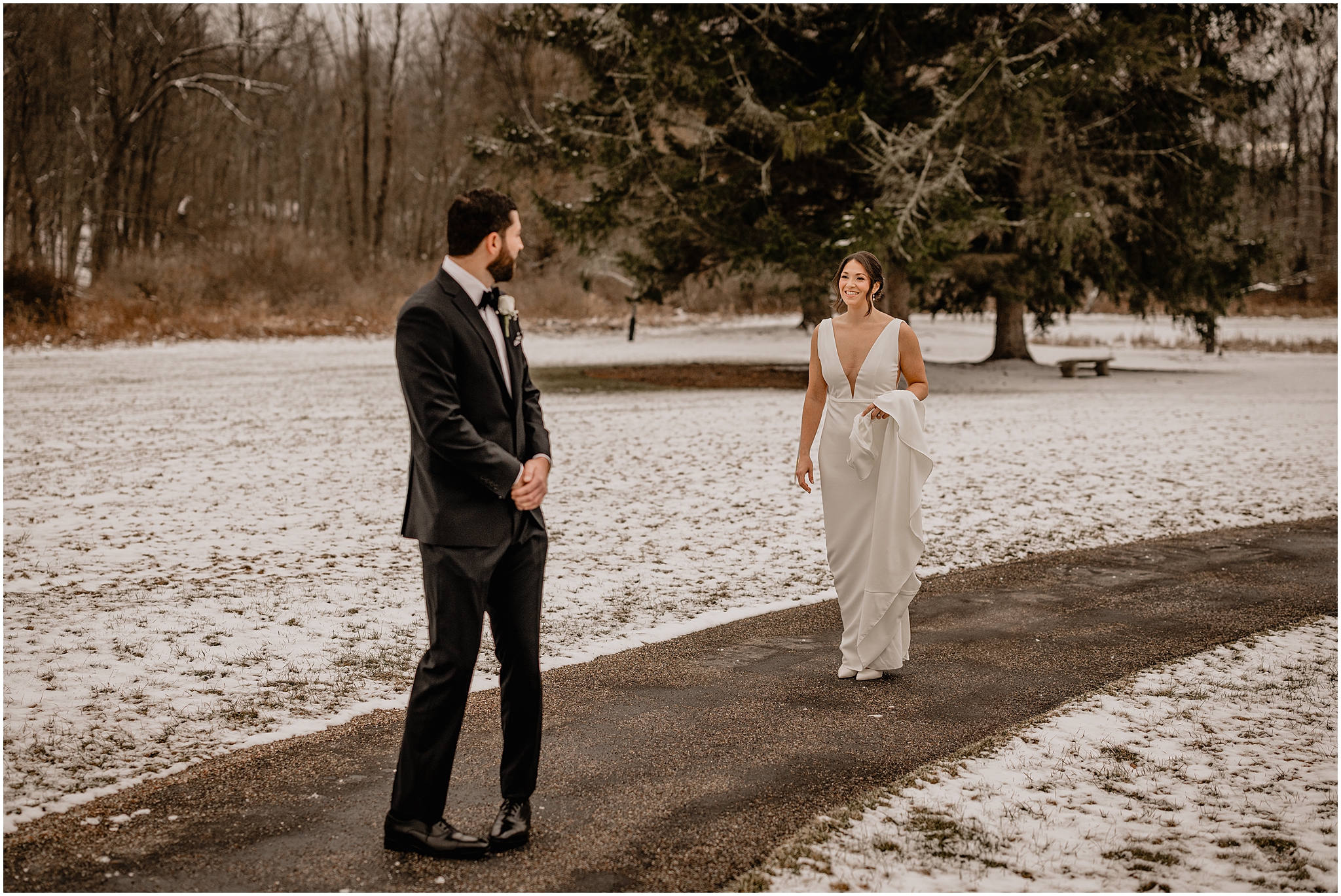 Couple's first look before their winter wedding at The Barn at Perona Farms.