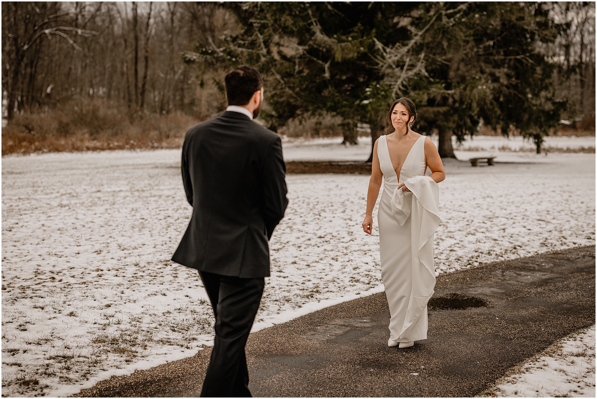 Couple's first look before their winter wedding at The Barn at Perona Farms.